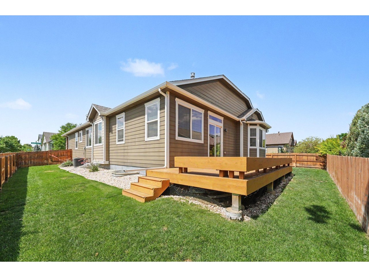 Welcome home to this beautifully maintained ranch where comfort, convenience, and flexible living come together. Thoughtfully designed with true main-floor living, the main level features vaulted ceilings, a spacious primary suite, two additional bedrooms including one perfect as a home office or guest room a second full bathroom, and a convenient main-floor laundry room. An open, flowing layout creates a bright, welcoming feel throughout. At the heart of the home is the stunning kitchen, featuring a huge center island, timeless cityscape cabinetry, beautiful light gray countertops, a classic white subway tile backsplash, a pantry, and brand-new refrigerator, dishwasher, and microwave (2026). Beautiful light blonde hardwood floors, professionally refinished in 2026, add warmth and style throughout the main living areas. Privately tucked just off the kitchen, the bright primary suite is a true retreat with elegant French doors, a coffered ceiling, a luxurious five-piece bath with a soaking tub, large walk-in shower, dual vanities, and a generous walk-in closet. The fully finished basement offers a huge family room, an additional bedroom, and a 3/4 bathroomperfect for guests or multi-generational living. A large unfinished bonus room is ideal for a home gym or storage, and the basement is plumbed for a future wet bar. Relax on the welcoming front porch or spacious backyard deck, built in 2018 and freshly stained in 2026. Situated on a desirable corner lot, the yard features an automatic sprinkler system, with a neighborhood park and walking trails just minutes away. Additional highlights include a 3-car tandem garage, tankless water heater (2020), and roof replaced in 2019. This beautifully maintained home shows exceptionally well and is an absolute must-see. With its thoughtful upgrades, flexible floor plan, and exceptional value, youll want to experience it in person before its gone.