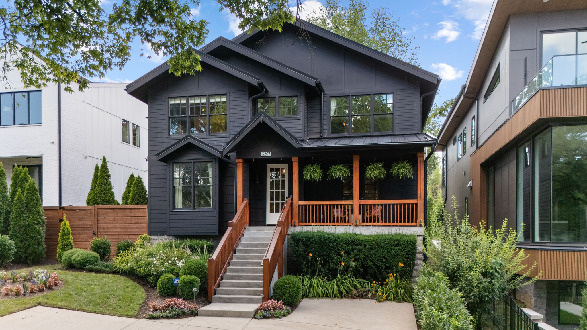 Don’t miss this rare opportunity to own a stunning 4-bedroom, 3-bath home perfectly situated across from Sevier Park and just steps from the vibrant shops, cafés, and restaurants of 12 South. Combining charm, modern style, and thoughtful functionality, this home is your own private retreat in the heart of the city. The open-concept main level features a chef’s kitchen with a generous island, quartz countertops, and a separate dining area—ideal for everyday living or entertaining. The dedicated office space can also serve as a formal dining room, while the spacious great room centers around a cozy fireplace with sliding glass doors that open to a beautifully landscaped, zen-inspired backyard—perfect for relaxation or gatherings. A main-level bedroom with an ensuite bath adds convenience for guests. Upstairs, the expansive primary suite is a true sanctuary with vaulted ceilings, a striking bark accent wall, and a custom ethanol fireplace. The luxurious spa-style bath boasts a soaking tub, oversized shower, dual marble sinks, and a walk-in closet. Step outside to your private covered balcony overlooking lush gardens—a perfect spot for morning coffee or quiet reflection. Two additional bedrooms share a well-appointed bathroom, and a large flex/media room overlooks the park. The two-car garage features epoxy floors, a custom wood accent wall, and a mini-split AC unit. There are four additional parking spaces (two in front, two in the alley) Additional highlights include hardwood floors throughout, a built-in Sonos sound system, marble & quartz countertops, programmable Lutron lighting, and generous storage. Best of all, there’s no HOA! Be sure to admire the striking mural by local artist Dustin Hedrick in the foyer—can you recognize any faces? This home perfectly blends luxury, function, and artistic flair in one of Nashville’s most desirable neighborhood in the best location!  Make sure to check out the Farmer's Market on Tuesday nights at Sevier Park - it's worth it!