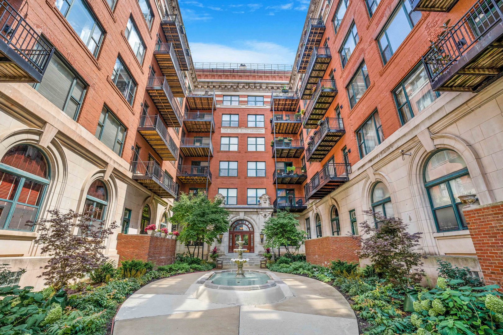Welcome to Unit 103 at 1439 S Michigan Ave, a spacious and truly unique 2-bedroom + den, 2.5-bathroom condo nestled in a beautifully preserved historic building in the heart of the South Loop. This stunning home features an expansive open floor plan with captivating, oversized north-facing windows that flood the space with natural light. Impeccable architectural details include exposed brick, soaring ceilings, and gleaming hardwood floors throughout, creating the perfect blend of character and modern style. The kitchen is a chef's dream, boasting granite countertops, a large island, all Viking appliances and Subzero refrigerator. All overlooking a spacious living and dining area, ideal for entertaining. The private main-level primary suite offers convenience and comfort  while the lofted second floor features an open den or office space, a second bedroom, and a full  remodeled bath, perfect for guests or a work from home setup. Additional features include in-unit laundry and ample storage. Located just steps from public transportation, Grant Park, Lake Michigan, Museum Campus, Chicago Women's Park, and some of the city's best dining and cultural attractions. Don't miss your chance to own this one of a kind South Loop gem, schedule your private tour today!