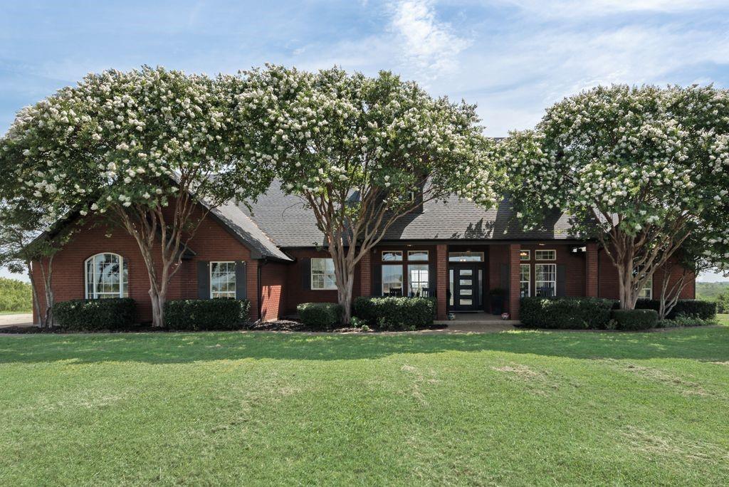 Escape to your own private paradise on 11.64 unrestricted acres with this beautifully renovated 4-bedroom, 2.5-bath home, where luxury, comfort, and wide-open freedom come together in one extraordinary package. With no HOA or restrictions, this property gives you the flexibility to live exactly how you want. From the moment you arrive, the deep covered front porch welcomes you, offering a peaceful spot to take in the tranquil landscape. The open floor plan makes entertaining easy, with an expansive great room that connects to both formal and informal dining areas. At the heart of it all, the kitchen is a chef’s dream with top-of-the-line ZLine appliances, elegant quartz countertops, and a beautifully tiled backsplash. The spacious primary suite is filled with natural light and offering private access to the back patio, and the ensuite bath feels like a spa with its double sinks, stand-alone vanity, oversized walk-in glass shower, and luxurious soaking tub. In a split floorplan, 3 more bedrooms make it easy to host friends and family. Step outside to your own backyard oasis, where a sparkling gunite in-ground pool and spa invite you to relax and unwind. Host unforgettable gatherings under the pergola-covered back patio or follow the stone walkway to a second pergola-shaded seating area—ideal for summer BBQs, evening cocktails, or morning coffee with a view. The land is wide open and ready for whatever your dreams may be. Build a workshop, raise animals, start a garden, or simply enjoy the peace and natural beauty. A 3-car oversized garage with room for a second freezer or a small hobby space. Property has a 50 amp RV hookup with a gravel parking pad that is accessible for recreational toys. The stock tank that attracts local wildlife add even more to love. Whether you’re craving room to roam, a place to entertain, or the freedom to live without limits, this one-of-a-kind Central Texas property delivers it all.