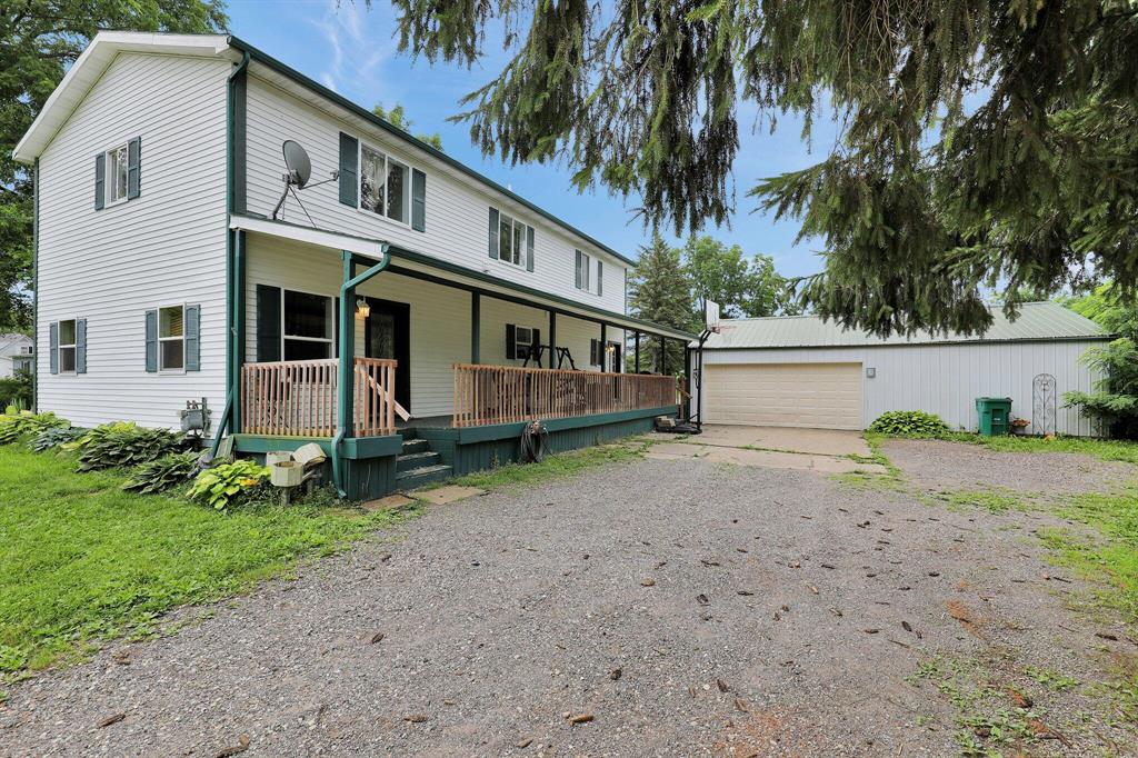 A spacious 4 bedroom, 2 bath home set on nearly an acre in a peaceful country setting just minutes from town. The home features a functional layout with generous living areas, a mudroom upon entry, and convenient upper level laundry. Upstairs includes a small den that's perfect for a home office, study nook, or creative space. A large covered porch offers the ideal spot to relax or entertain. Outside, you'll find a large  pole barn with a metal roof and electrical (approx. 31x35) ideal for vehicles, tools, or hobbies, plus two additional outbuildings (Approx. 13 x 8 and 9'11' x 9'8') offering great storage or workshop potential.The above ground pool can stay or be removed at the buyer's request. Enjoy the flexibility and space of country living with the convenience of nearby schools, shops, and park. A great value for the size and location, with room to build equity through updates. Priced accordingly.