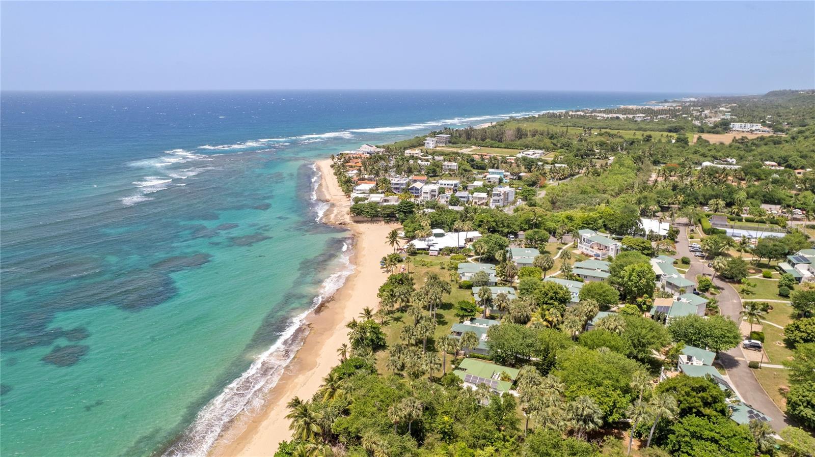 Discover the allure of Villa Montaña Beach Resort, an award-winning, premier condo hotel nestled in the sought-after Barrio Bajuras of Isabela, Puerto Rico. Located on 32.75 acres of pristine beachfront, this exclusive property offers an exceptional investment opportunity, combining luxury with strong earning potential.


The resort is located in a serene area offering 3 miles of secluded, untouched beaches ideal for those seeking privacy and tranquility. With its prime coastal setting, Villa Montaña is an unparalleled retreat that has earned widespread recognition. The property boasts world-class amenities, making it an attractive choice for both leisure and business travelers.
 
The resort’s rental management program delivers consistent revenue, making it a lucrative investment and ensuring a steady stream of income for owners. The sale includes five beach villas that are currently part of the rental program.


Villa Montaña is more than just a getaway it is a complete resort-style community with extensive facilities to accommodate intimate gatherings, corporate events, and large celebrations. Amenities include Eclipse Restaurant, a full-service dining venue offering beachfront dining. Tennis court, fitness center, and two pools with lounge areas. Event spaces for weddings, conferences, and social gatherings. A flower nursery, a bike station, and a front desk arrival area. Extensive green spaces and manicured tropical landscapes. The 52,512.29 square meters (12.98 acres) of community space allows guests to enjoy nature’s beauty while offering plenty of room for events and activities.
 
The sale includes an adjacent 8.58-acre beachfront parcel known as Les Trois Sirenes, which offers substantial potential for further development. This parcel is perfectly suited for: Expanding the resort's accommodations with additional luxury villas. Developing high-end residential properties that enhance the brand's prestige. Introducing state-of-the-art amenities to complement the resort’s already extensive offerings
 
The zoning and location make it eligible for the Tourism Tax Incentive Program, providing tax advantages for future developments. Isabela offers a range of attractions that cater to nature lovers, adventure seekers, and culture enthusiasts: 12 pristine beaches perfect for surfing, swimming, and sunbathing. Guajataca State Forest is known for its hiking and natural beauty. Paseo Lineal, a 4.5-mile cycling and jogging path. Iconic landmarks such as La Cara del Indio sculpture.
 
Located just 15 minutes from Rafael Hernández Marín Airport, the resort is easily accessible for both local and international guests, further enhancing its appeal to tourists. 

This is the perfect opportunity for hoteliers or real estate developers seeking a unique, profitable venture. With the ability to expand the resort, increase capacity, or develop new luxury residences, Villa Montaña offers unmatched growth potential. Its combination of high-end amenities, an established brand, and a prime location makes it a standout choice for those seeking to capitalize on Puerto Rico’s thriving tourism industry.

Whether you are looking to acquire a profitable, turnkey resort operation or seeking a strategic investment to expand into luxury tourism, Villa Montaña Beach Resort is the opportunity of a lifetime.