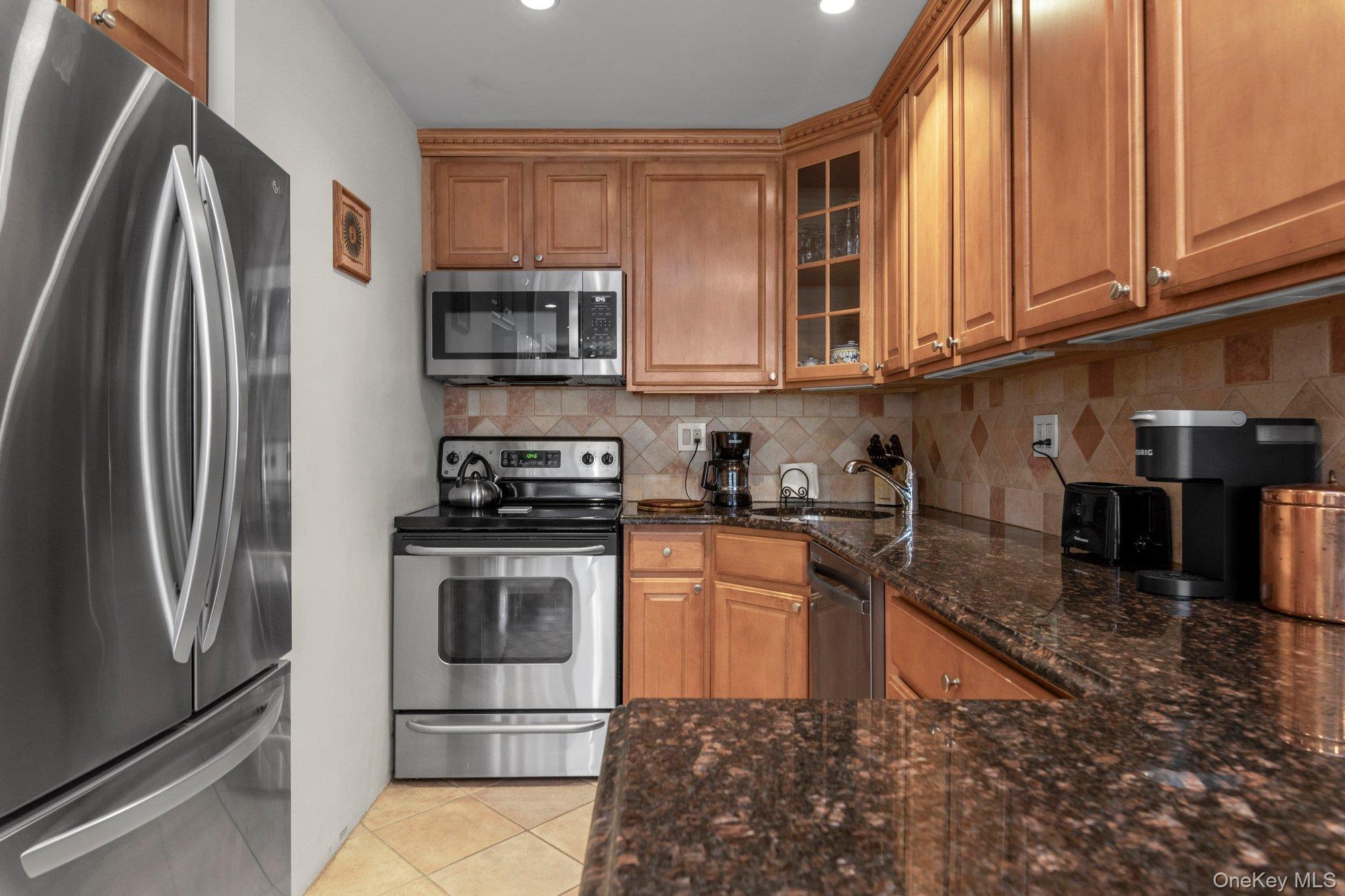 Stunning NYC type apartment which features wall of windows with abundance of natural light.  Large terrace for entertaining. Flat ceiling with recessed lighting adorn this spacious, open concept unit.  New kitchen with maple cabinets, granite countertops, stainless appliance and updated electric.  Built-in wood casing over all baseboard heating.  Euro bath with lots of storage. Cherrywood hardwood floors throughout.  Prime parking space available for transfer conveniently located.  Lehavre offers 2 outdoor pools, tennis, gym, playgrounds and cafe.