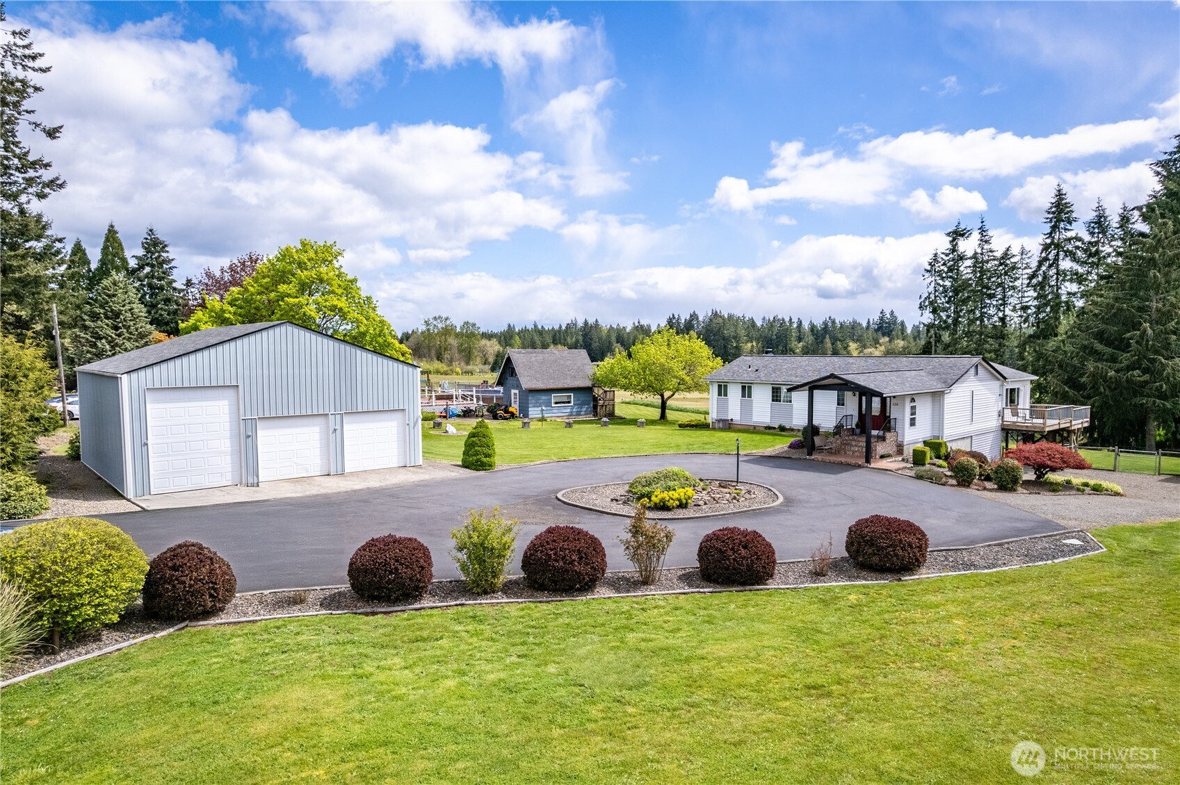 Stunning 4 acre listing with Mt. Rainier views. 3,038 sq ft, 3bd, 2.5bth. Just around the corner from the high school--country living with city conveniences. Features a huge back deck, a 1 year home buyer's warranty, a detached garage, and a 3 bay shop with a car lift--perfect for hobbies or work. Schedule a tour today!!