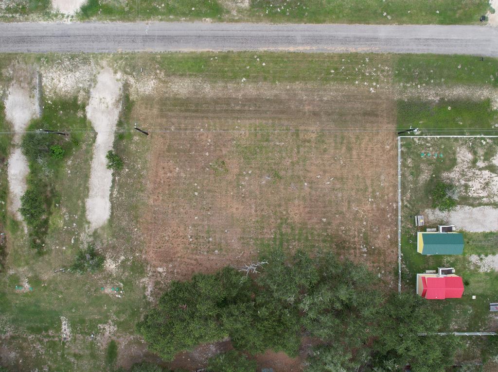 County Living with Coastal Perks! Bring your RV, mobile home, or custom build plans to this versatile 50' x 120' lot located in the peaceful county area of Rockport, TX—just minutes from the water, shopping, and dining. With no city restrictions, this property offers the freedom to create your ideal coastal escape or short-term rental setup. Whether you're looking for a weekend getaway, investment property, or full-time residence, this lot is ready for your vision. Utilities nearby—please confirm with the city regarding access to water and gas.  Two adjacent lots are also available, each listed separately—giving you the option to own up to 3 lots total! Enjoy the laid-back lifestyle Rockport is known for—bring the boat, the RV, and your dreams!
