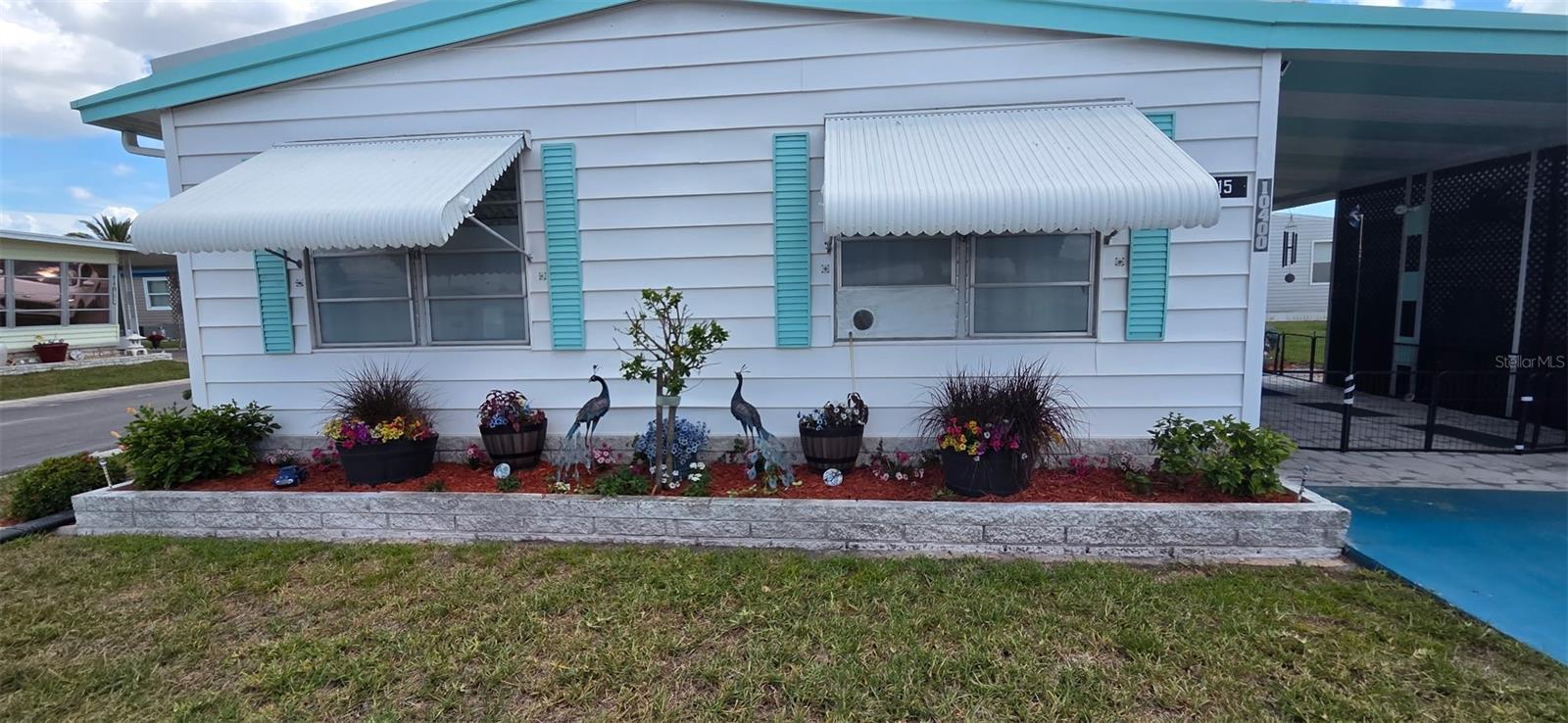 Lovely 2/2 Home in Resident owned Holiday Shores Mobile Home Park. This home has updated flooring, kitchen and bathrooms. This home  has large open spaces for wheel-chair access. Holiday Shores allows 2 small pets and is located on Lake Seminole.  Beautiful Clubhouse that has many activities to enjoy and participate in!  Enjoy the Heated Pool, Community Boat Ramp, Covered Shuffle Board Courts.and private Gazebo Park settings. This Park allows 2 small Pets. Close to Beaches, Restaurants and Shopping. Centrally located to Airports for easy travel.  This is Florida living at its Best!