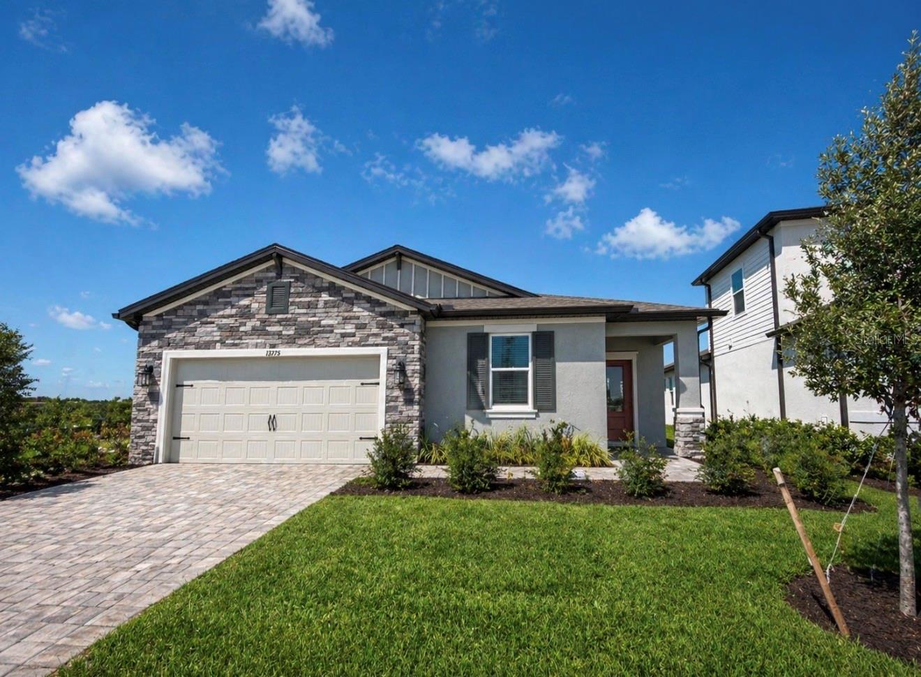 Under Construction. Welcome to Coasterra, where modern design meets effortless Gulf Coast living in one of the area’s most desirable gated communities. Step inside this beautifully designed home and immediately notice the abundance of natural light that fills every corner. Thoughtfully crafted with zero wasted space, this four-bedroom, two-bath residence with a two-car garage offers both comfort and functionality. The open-concept layout seamlessly connects the kitchen, dining, and great room, creating an inviting space that’s perfect for entertaining guests or enjoying everyday life with family. Large windows and open sightlines enhance the airy feel, while the well-appointed kitchen features generous counter space, a smart, efficient layout, and plenty of room to cook, gather, and create lasting memories. Offered by M/I Homes, Coasterra is ideally located just west of Interstate I-75, placing you within easy reach of everything you need while still offering a peaceful, tucked-away setting. These expertly crafted homes are powered by natural gas, combining modern efficiency with elevated design and long-term value. With close proximity to shopping, dining, and outdoor recreation, convenience is always within reach. Surrounded by scenic lakes and lush landscapes, the community itself is designed to feel like a private resort. Residents enjoy a lifestyle centered around relaxation, recreation, and connection. Whether you’re taking a quiet evening stroll along the boardwalks, enjoying a morning jog on the lakeside paths, or spending time with friends at the clubhouse, there’s something here for everyone. Coasterra’s exceptional amenities include a beautifully designed amenity center with a social lounge, a lakeside pavilion bar, and a pier perfect for taking in sunset views. Outdoor enthusiasts will appreciate the canoe lodge, expansive trails for walking, jogging, and biking, as well as pickleball and shuffleboard courts. A dog park and sports fields add even more ways to stay active and engaged. This is more than just a home—it’s a lifestyle defined by comfort, community, and the best of Florida living.