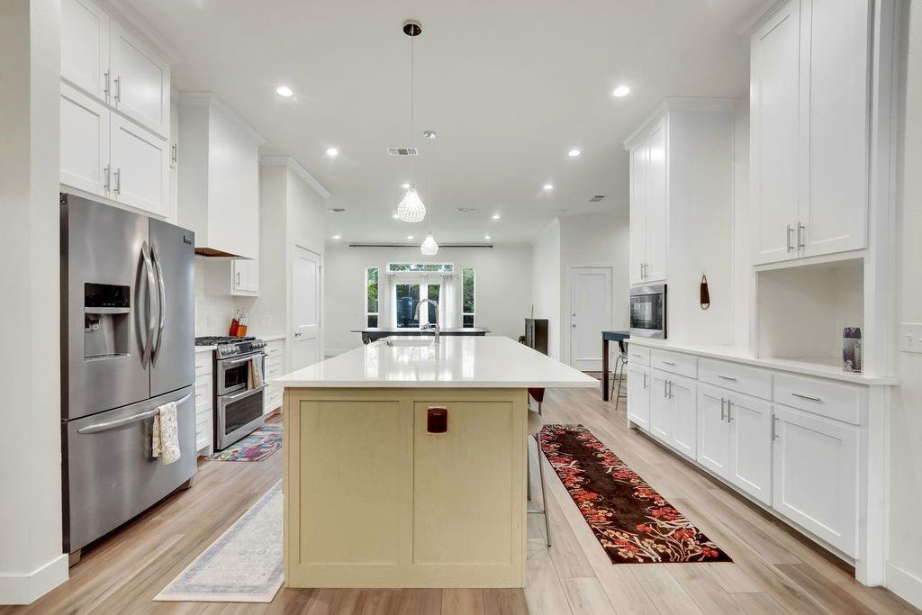 Welcome to your home! This fully renovated North Dallas masterpiece delivers luxury, comfort, and modern living in every corner. Featuring 4 bedrooms, 3 full bathrooms, this home is truly move-in ready and built to stand out. From the curb, the home shows off with fresh landscaping, classic red-brick charm, and a brand-new roof installed in 2025. Step inside to an open, airy layout filled with natural light, high ceilings, designer lighting, and modern wood-look flooring throughout. Every inch of this home has been elevated to today’s standards. At the heart of the home is your chef’s kitchen, complete with a massive island, quartz countertops, upgraded appliances, and a large walk-in pantry. Perfect for entertaining, meal prepping, and hosting family gatherings in style. The primary suite feels like a private spa retreat, featuring a freestanding soaking tub, frameless glass walk-in shower, dual vanities, and an impressive custom closet system. All three bathrooms have been beautifully reimagined with high-end tile, fresh fixtures, and clean, modern finishes .Other major upgrades include a new water heater (2024), updated systems, an oversized laundry room, and beautifully renovated secondary bedrooms. The layout offers flexibility for multi-generational living, a home office, guest suite, or children’s wing. Located minutes from George Bush, Dallas North Tollway, top-rated schools, shopping, and dining — this home blends convenience with luxury. Bring your pickiest buyer — this is the cream of the crop in this location. Homes with this level of renovation rarely hit the market. Don’t miss it.