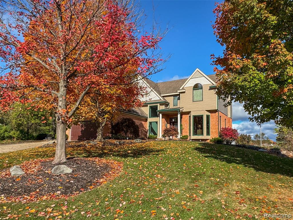 Experience luxurious lakefront living in this custom 4-bedroom, 3.1-bath home on all-sports Sugden Lake in White Lake. This exquisite estate offers stunning water views, a sandy bottom, and a private dock—perfect for swimming, boating, and enjoying the lake lifestyle.

The gourmet kitchen, remodeled in 2023, is a chef’s dream featuring stainless steel appliances, granite countertops, and an outdoor kitchen for effortless entertaining. Enjoy cozy evenings by one of the four gas fireplaces—located in the great room, family room, primary suite, and basement.

The home showcases hardwood floors, custom tile work, and elegant crown molding, with a study featuring built-in cabinetry and a charming bay window. The primary suite is a true retreat with a glamour bath, jetted tub, and spacious walk-in closets. The finished lower level is perfect for entertaining, complete with a wet bar, indoor sauna, steam room, and easy walk-out access to the outdoors.

Additional highlights include Anderson windows and sliders 2021, HVAC systems 2021-2025, a newer shed, water softner 2023, whole house generator, and a freshly painted interior (2023). With endless upgrades and exceptional craftsmanship throughout, this lakefront gem perfectly blends comfort, elegance, and the ultimate in waterfront living.