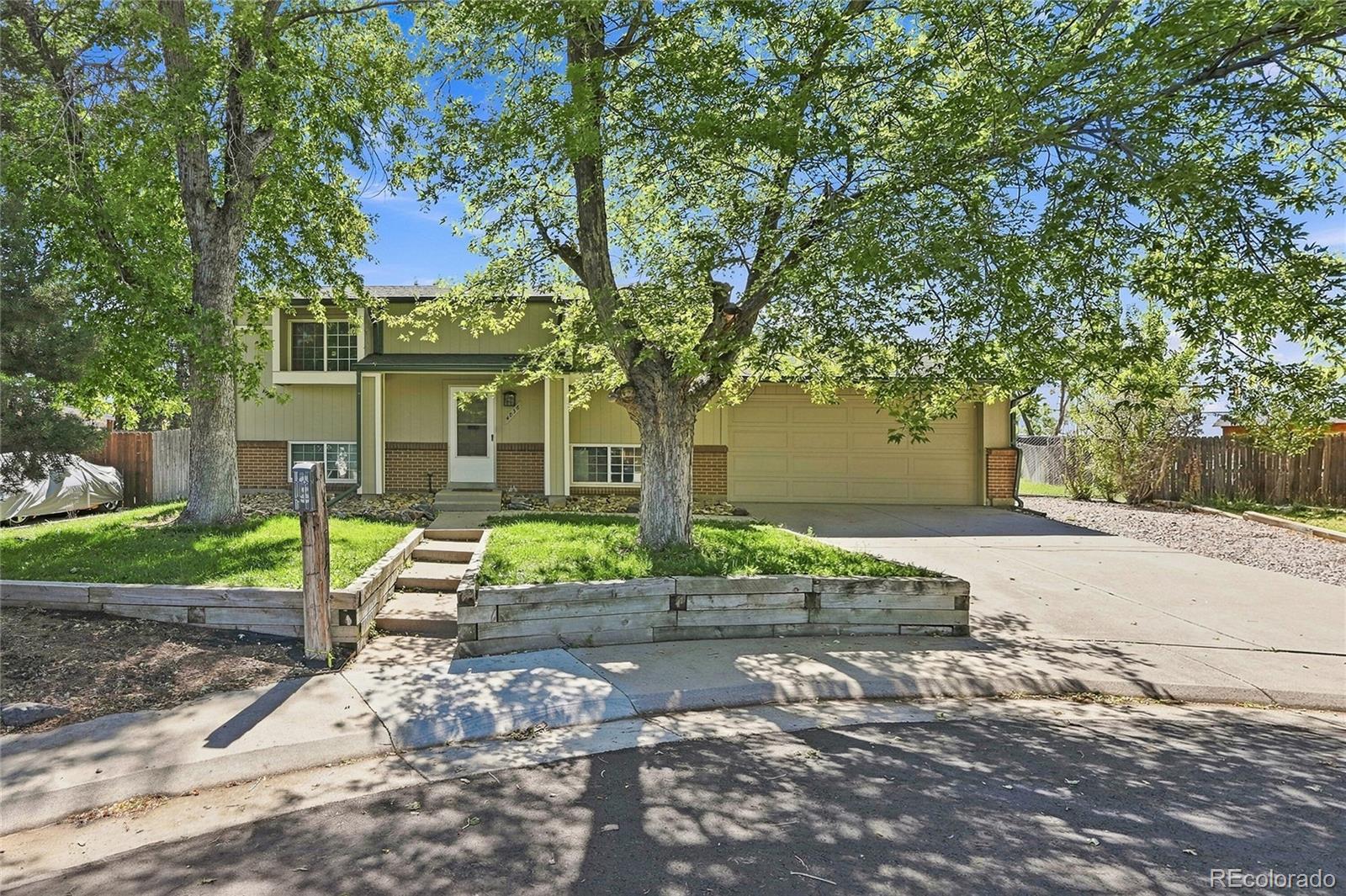 Welcome to this well-maintained 3-bedroom, 2-bath split-level home with NO HOA! Tucked away on a cul-de-sac, the property offers lower traffic, added privacy, and plenty of parking. Conveniently located near Smoky Hill Road and Buckley Road, with Smoky Hill High School within walking distance and located in the Cherry Creek School District.The upper level features two bedrooms, a full bathroom, kitchen, dining area, and living room. The lower level offers a spacious primary bedroom, recently updated full bathroom, second living area, laundry room, and additional storage.The oversized garage is a standout feature, with enough room to accommodate a crew-cab 3/4-ton pickup and a full-size car at the same time.Recent improvements include exterior paint and extensive interior painting in 2024, along with a refreshed lower-level bathroom. Main sewer line repairs were completed in early 2026. The roof and A/C system were replaced in 2016, along with new gutters featuring Gutter Helmet leaf protection. A premium insulated garage door and opener were installed in 2017, and the water heater was replaced in 2020. The sprinkler system has been regularly maintained and is in good working condition.