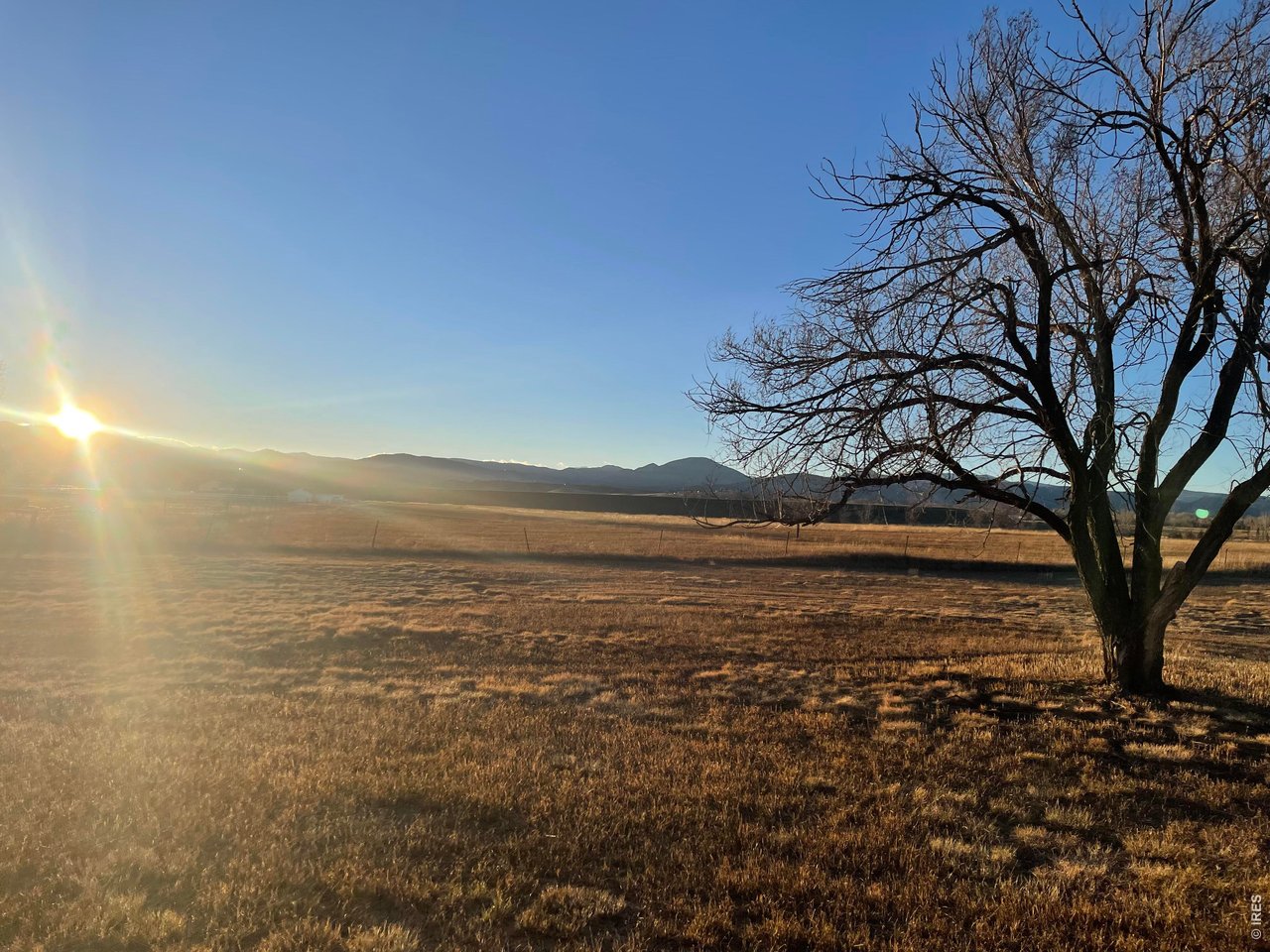 RARE opportunity to own a beautifully appointed home on flat acreage in West Loveland backing directly to a state wildlife area with STUNNING foothill and mountain views! Properties with this combination of privacy, land, and proximity to town rarely come available. The home has been fully remodeled with modern finishes and thoughtful updates throughout, creating a bright and comfortable living space. Large windows bring in natural light and showcase the surrounding landscape, allowing you to enjoy the foothill scenery while feeling like you're in the country while still being close to all Northern Colorado has to offer! Beyond the cosmetic updates, the home's major systems are all brand new, HVAC, plumbing, and septic - giving you the peace of mind of no costly repairs for years to come! Step outside and enjoy wide-open space, wildlife, and unobstructed foothill views right from your back door. The 4-acre lot provides plenty of room for outdoor living, recreation, animals, or future improvements. Located in highly desirable West Loveland, the property offers the perfect balance of country living and convenience. Just minutes from downtown Loveland, shopping, restaurants, and everyday amenities, while also being served by highly rated local schools. If you've been searching for a Loveland acreage property with mountain views, privacy, and a remodeled home; this property offers a RARE opportunity to enjoy Colorado living with space, scenery, and easy access to town.