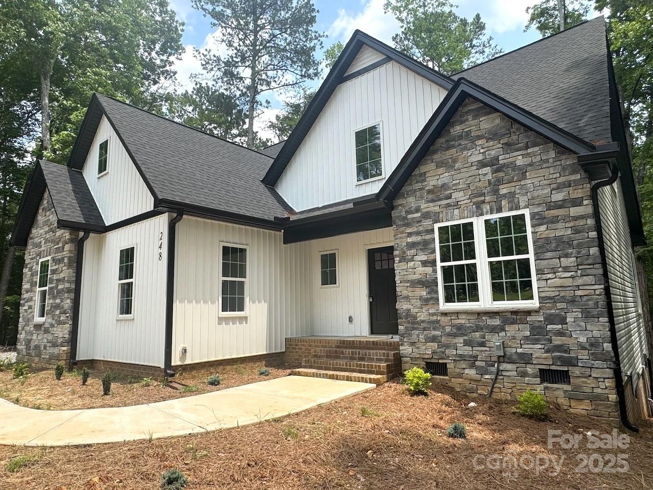 New Construction in Woodrun on Lake Tillery! Be the first to own this beautifully crafted 3BR/2.5BA home in a gated lake community. Features include an open floor plan, quartz countertops in kitchen & baths, upgraded stainless steel appliances (including refrigerator), and a spacious main-level primary suite w/ en-suite bath and tray ceiling. Upstairs has two bedrooms and a versatile bonus room—perfect for guests, office, or media. Enjoy a large front yard, private wooded backyard, & rear deck ideal for entertaining. Woodrun amenities include lake access via boat ramp, lakefront clubhouse, pool with lake views, tennis/pickleball courts, basketball court, playground, community boat slips for lease (waitlist applies) and forested walking trails. With fiber internet available, you can escape to the lake while still being connected. Surrounded by nature, this home is perfect for weekend getaways and everyday living. A rare new construction opportunity in a desirable lake community!