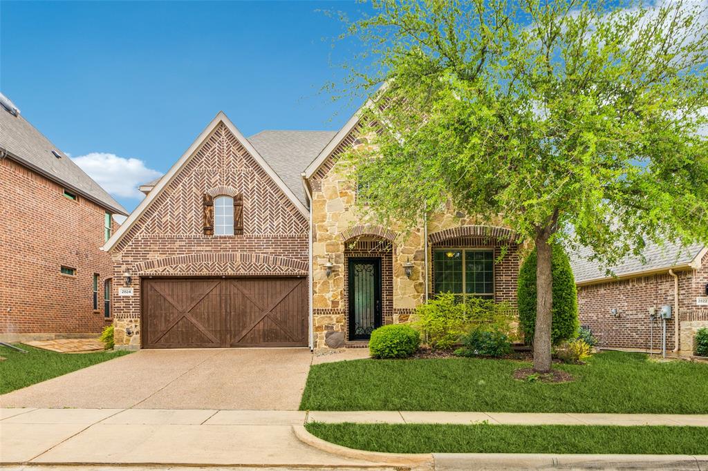 Welcome to this beautifully crafted brick and native stone home that combines timeless elegance with modern comfort. From the inviting front porch and meticulously maintained landscaping to the thoughtful interior design, this 4-bedroom, 3.5-bath residence offers everything you need for refined living. Step inside to discover rich hardwood floors, crown molding, and a warm stone fireplace that create an atmosphere of sophistication. The executive office-study provides a quiet retreat for work or reading, while the formal dining room sets the stage for memorable gatherings. Upstairs, a spacious game room offers the perfect spot for entertainment or an area for the kids to gather and play. The gourmet kitchen is a chef’s dream, featuring a large island with breakfast bar, granite countertops, stainless steel appliances, a gas cooktop, and a generous walk-in pantry. The private master suite is your personal sanctuary, boasting a spa-like bath with dual vanities, a jetted tub, separate shower, and a roomy walk-in closet. Additional bedrooms are well-appointed, providing ample space and comfort for family or guests. Enjoy outdoor living in the spacious backyard with a charming patio that is perfect for barbecues or quiet evenings. A separate utility room with washer and dryer completes this exceptional home. Don't miss this perfect blend of luxury, comfort, and functionality!