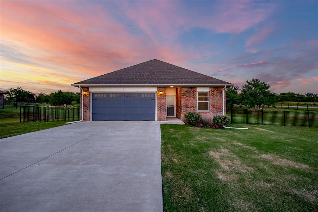 Welcome to this like-new gem situated on an almost one acre, corner lot in a desirable North Edmond suburban addition! Built in 2022 and meticulously maintained, this 3-bedroom, 2-bathroom home combines modern upgrades with timeless charm. Step inside to discover a bright and open layout featuring thoughtfully upgraded lighting throughout, adding a touch of elegance to every room. The home also boasts enhanced plumbing fixtures, upgraded paint selections throughout and a layout designed for both functionality and style.
Outside, you’ll find a fully enclosed wrought iron fence surrounding the expansive yard—perfect for privacy, pets, or play. There is a shed with an elevated approach making it easy to store lawn equipment and much more. You will also find an additional concrete pad perfect for the future plans of a pavilion or another storage building. The garage includes a professionally installed in-ground storm shelter and a separately insulated area for the water heater, both added by the current homeowner with safety and efficiency in mind. This move-in ready home offers peace of mind, space to spread out, and upgraded finishes—all just minutes from the conveniences of Edmond. The additional also features a neighborhood playground. Don’t miss your chance to make it yours!