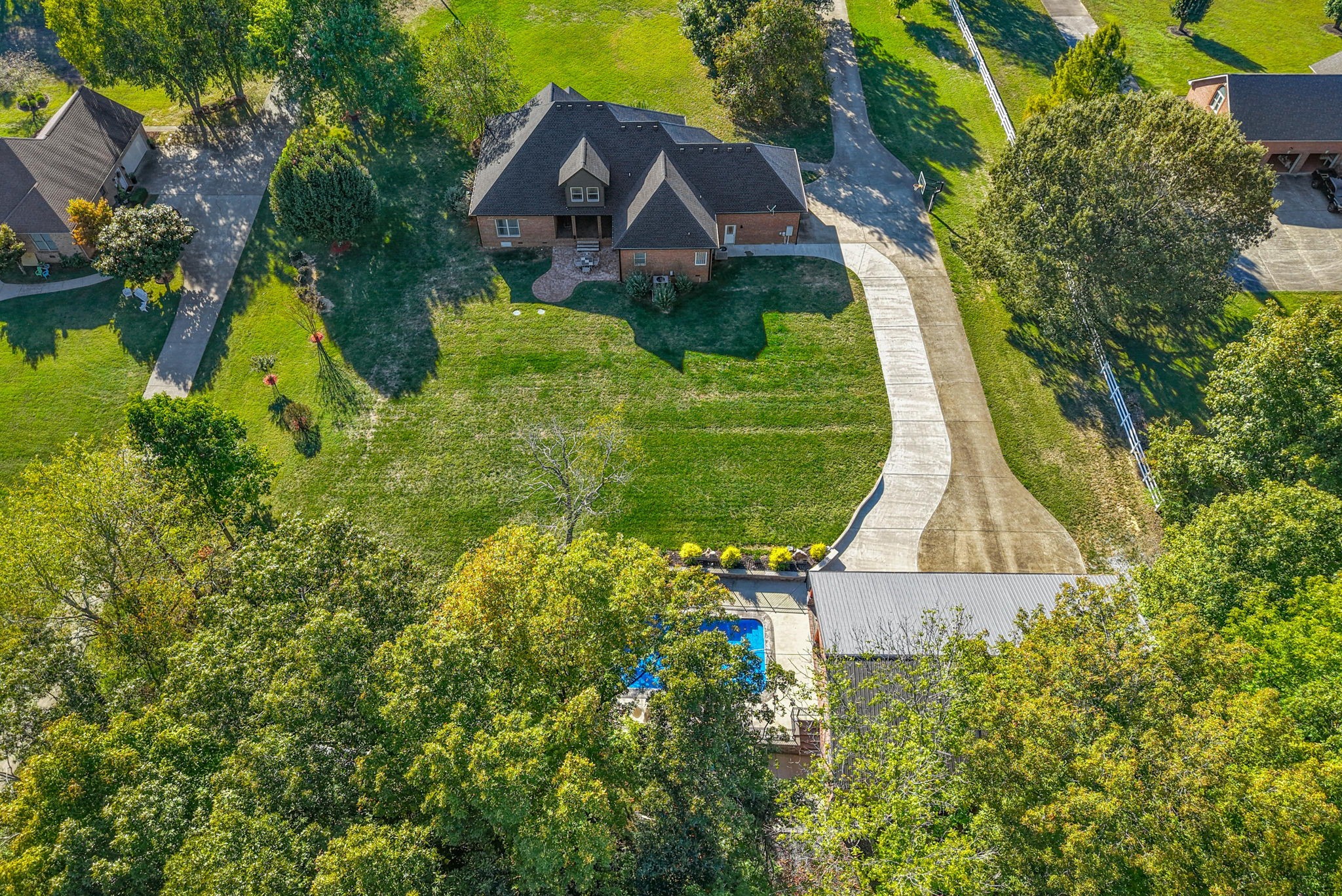 This home is a dream come true! Located just outside the city limits, but close to everything you could want and situated on 5 acres with the perfect mix of wooded and cleared land, this is the one! The home checks every block with 4 bedrooms on the main floor, 2 additional bedrooms upstairs, a large office upstairs, a craft room upstairs with dedicated storage, a bonus space with a wet bar including a full-size refrigerator and microwave, and a custom theater room with 8 recliner seats and all equipment remains. The kitchen is every chef's dream! The custom cabinets wrap around the entire kitchen, a standalone refrigerator and freezer, induction cook top, double ovens situated to not block the walkways or limit cabinet use. The seller really put all of the extras in this home with a gas line for the dryer and the cooktop for future use. The main house has 3 HVAC units to efficiently heat and cool the home while being easy on your wallet. The laundry room has cabinets galore with a sink for washing anything you don't want to put in the washer yet. The home includes a tankless water heater and central vac unit to elevate your home living experience even more. 
The outside is even better! The detached shop is fully heated and cooled, including one bay dedicated to vehicle restoration. The pool house is attached to the shop and was added in 2022. It includes a full kitchen and bathroom. The 16x34 saltwater pool was installed in 2022 and is wired for a heater already and includes tons of lights and speakers and a cover. The property includes a shooting range as well.
Home has additional rooms not listed in measurements. Additional bedroom/office upstairs 15x11. Laundry/utility room is 11x10. Breakfast room is 12x10.
Detached shop is 1692 square feet and heated and cooled. Pool house is 949 Sq ft.
The home is being renovated and the price will increase as the renovations are done.