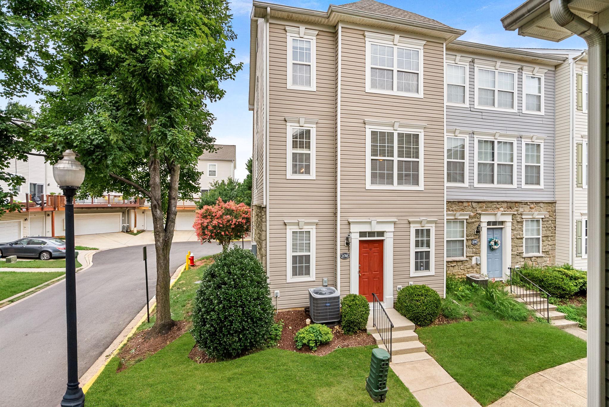 This charming end-of-row townhouse in the desirable Parkside at Ashburn community offers a perfect blend of comfort and style. Built in 2001, this Colonial-style home features 2 spacious bedrooms and 2 full bathrooms, with a two-car garage is a perfect starter home or investment property. Step inside to discover an inviting open floor plan that seamlessly connects the living, dining, and kitchen areas. The family room, conveniently located off the kitchen, is perfect for entertaining or cozy evenings by the gas fireplace, complete with a mantel for decor. The kitchen boasts upgraded countertops, an island for additional prep space, and a pantry for all your storage needs. Elegant details such as crown moldings, chair railings, and wood floors enhance the home's aesthetic appeal. The primary suite features a walk-in closet and a well-appointed bathroom with a tub shower, ensuring a private retreat. Natural light floods the space through thoughtfully placed window treatments. Enjoy the convenience of an upper-floor laundry area, along with an attached garage and driveway parking for four vehicles. The community amenities include a refreshing outdoor pool, fitness center, basketball courts, and playgrounds, catering to an active lifestyle. With low association fees covering common area maintenance and snow removal, this property offers both comfort and convenience in a vibrant community setting. Don't miss the opportunity to make this lovely townhouse your new home!