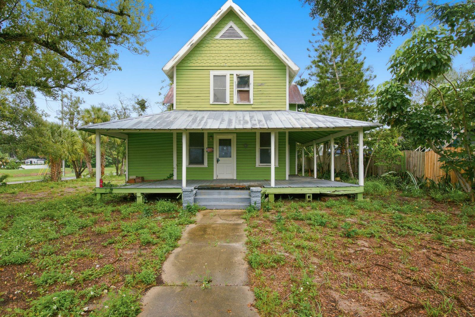Virtually Staged. SOME HOMES HAVE A HISTORY. OTHERS ARE WAITING FOR SOMEONE TO WRITE THEIR NEXT CHAPTER. Nestled in the heart of historic Tarpon Springs, 226 N Grosse Avenue offers something increasingly difficult to find: an opportunity to honor the charm and character of yesterday while creating a home for generations of tomorrows.Imagine the simple pleasures of Old Florida living. Morning coffee on a welcoming front porch, evenings spent enjoying the neighborhood, golf cart rides through town, and a home that feels as though it has always belonged. Your new home is centrally located and walkable to the Tarpon Springs Downtown District, a Florida Main Street, as well as the world famous Sponge Docks! This is the kind of place where history isn't simply remembered, it's woven into everyday life.And while the existing residence has reached a crossroads in its story, its next chapter has already been thoughtfully envisioned. The current owners have invested considerable time, resources and care navigating the architectural, engineering and historic-preservation processes to help make a new beginning possible.An extensive package of architectural plans and renderings by Sandbar Architecture, engineer-stamped documents, soil studies, survey and related due diligence has been assembled. The City of Tarpon Springs Heritage Preservation Board has issued a Certificate of Appropriateness authorizing demolition of the existing contributing structure and approving a proposed replacement residence, detached garage with accessory dwelling unit (ADU), and pool, subject to specified conditions. A variance for the proposed garage/ADU location has also been obtained.The proposed design captures the timeless appeal of traditional Florida architecture while envisioning the comforts of modern living. Picture an inviting two-story residence, a detached garage with private living quarters above, and an outdoor retreat designed for gathering, entertaining and making memories.This isn't simply an opportunity to purchase a property. It's an invitation to carry a carefully considered vision across the finish line.The property is offered AS-IS with the existing structure in place. Demolition cannot proceed until the Building Department approves the replacement building plans and issues the required building permit. All approvals remain subject to their respective conditions, expiration dates and applicable City requirements. Buyers may explore continuing the proposed design or pursuing permissible modifications, subject to appropriate professional review and City approval.For someone who appreciates the soul of historic Tarpon Springs, the beauty of traditional architecture and the opportunity to create something meaningful for the future, perhaps the next chapter of 226 N Grosse Avenue is yours to write.Extensive project documentation available for buyer review. Buyer to independently verify permitting, construction feasibility, approval status, costs and rights to use architectural and engineering plans.
