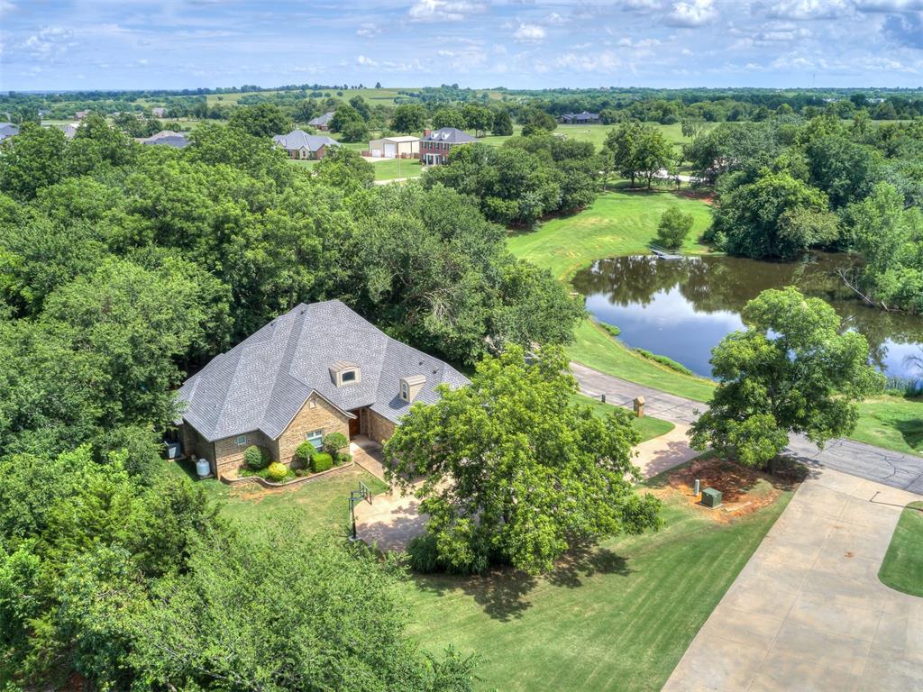 Tucked away on a quiet wooded lot outside Norman, this custom-built 3 bed, 3.5 bath home gives you privacy, space, and all the extras you didn’t know you needed. Sitting on 1.64 low-maintenance acres, you’ll love the peaceful feel and even catch a waterview of the neighborhood pond from the backyard.

Inside, the layout is super flexible with thoughtful custom touches throughout including 3/4 inch hardwood floors, solid core doors and extra wide doorways. The kitchen has beautiful cabinetry and a cozy eat-in dining area that opens right into the main living space—perfect for everyday life and entertaining. Upstairs, there’s a second primary suite with a full ensuite bath and its own private balcony, ideal for guests or just a quiet retreat with a view.

Movie nights are next-level in the dedicated theatre room, complete with a wet bar. And for Oklahoma weather peace of mind, there's a walk-in safe room in the garage. 

You’re just a mile from the new Selah development, but this home feels like a world away—quiet, private, and surrounded by nature. Come take a look and see what makes this place truly special.