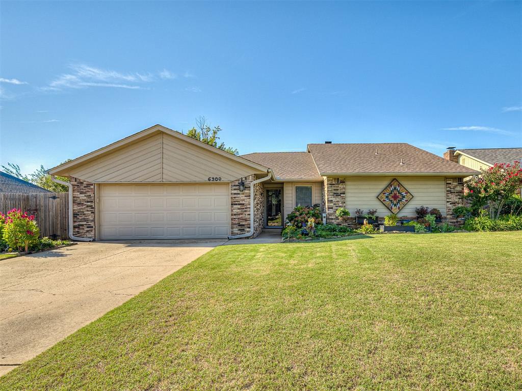 WOW DON'T MISS THE CHANCE TO SEE THIS ONE OWNER HOME WITH ALL THE UPDATES! This home is truly stunning. You will love the well-manicured flower beds that greet you when you arrive. Upon entering the home, there are lovely wood floors, wood beam ceiling and large UPDATED WINDOWS THROUGHOUT THE HOME! The KITCHEN IS JUST BEAUTIFUL AND WAS FULLY REMODELED IN 2022, with slow close cabinets and drawers, stylish blue backsplash and a 5 burner gas stove. The Laundry room has an added wash sink. THE REFRIGERATOR, WASHER AND DRYER to stay with the home!  The Master bedroom is large with its OWN SEATING AREA or office space. The Master bath has been renovated and has a great walk-in shower and 2 closets. Both of the closets have custom cabinetry. The guest bath has been remodeled as well, with stylish tile and shower surround. A lovely deck was added to the back of the home in 2019, making this outdoor space an oasis. There is a shed for added storage, and the flagstone paths along the side of the home help with water. THIS HOME HAS BEEN SO WELL CARED FOR! STORM SHELTER IN THE GARAGE. NEW ROOF GOING ON THIS MONTH. WHOLE HOME WATER SOFTNER and so so much more!