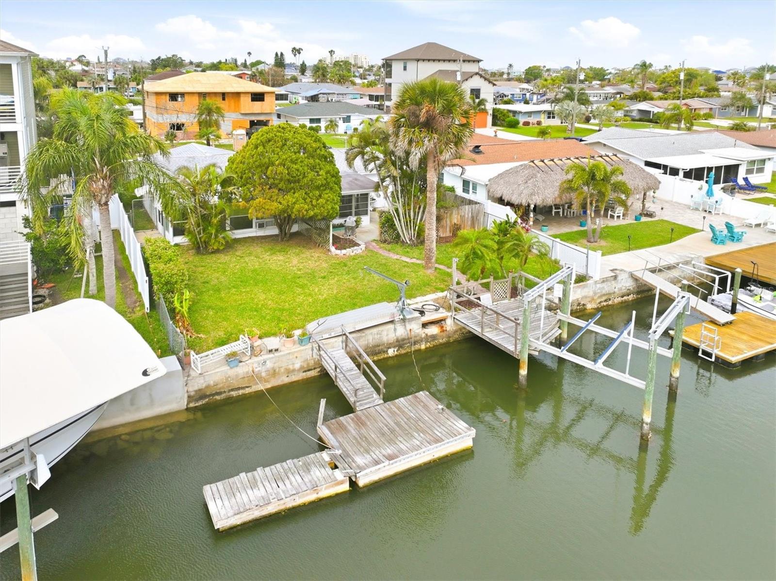 Experience the ultimate Gulf Coast boating lifestyle with this Direct Gulf Access 2-bedroom, 2-bathroom concrete block home, perfectly designed for serious boaters and anglers alike. Situated on 59 feet of saltwater canal frontage, this property features a 10,000 lb boat lift and floating dock, offering quick, bridge-free access to the Gulf of Mexico—just hop in your boat and go.Step into your backyard and into a true waterfront playground—watch dolphins and manatees glide by, or cast a line right from your seawall and reel in redfish, snook, and snapper. This is the kind of lifestyle most only dream about.Inside, the home has been completely renovated in 2024 with all permits in place, delivering a clean, modern coastal feel. Upgrades include:Brand new kitchen with granite countertops, new cabinets, and artistic backsplashNew appliances throughout including a gas rangeFully updated bathroomsTile flooring throughout for easy maintenanceFresh interior paintSome new impact windowsNew AC system (2024)Roof replaced in 2018This property is not only turnkey—it’s also flexible. With no HOA and no rental restrictions (beyond county guidelines), it’s ideal as a full-time residence, vacation home, or income-producing rental. Insurance is already in place with assumable flood policy ($5,100/year) and homeowners insurance ($5,000/year), adding convenience and potential savings.Welcome to Hudson Beach – Old Florida Charm Meets Boater’s ParadiseNestled along Florida’s Nature Coast just north of Tampa, Hudson Beach delivers a laid-back, authentic coastal vibe reminiscent of the Florida Keys decades ago. Here, boating isn’t a hobby—it’s a way of life. Cruise out to waterfront tiki bars, dock-and-dine restaurants, or spend the day anchored at nearby islands and sandbars.Just a short boat ride south brings you to the famous:Anclote Key Sandbar – a stunning tidal sandbar perfect for relaxing, shelling, and socializingAnclote Key State Park – an untouched barrier island with crystal-clear watersHead north and explore:Hernando Beach Flats – a shallow, family-friendly gathering spot ideal for anchoring and wadingHomosassa via the scenic Homosassa River—lined with waterfront restaurants and fed by freshwater springsBack on land, US-19 provides easy access to shopping, dining, medical facilities, and everyday conveniences. You’re also within about an hour of Tampa International Airport and roughly 90 minutes to Orlando’s world-famous attractions.This is more than just a home—it’s your gateway to the Gulf Coast boating lifestyle, where your days revolve around tides, fishing, island hopping, and unforgettable sunsets.Bring your boat, your fishing rods, and your flip-flops—paradise is waiting.