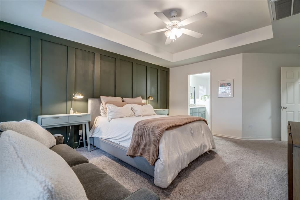 You pull into the drive and it already feels quieter here—just north of town, where things slow down without feeling remote. A classic brick front greets you, the kind of house that doesn’t need to announce itself—it just feels peaceful.Inside, the split floor plan immediately makes sense. The living space opens wide and easy, anchored by the fireplace—central without being showy. It’s a room built for real life: conversations that spill from the couch to the kitchen, evenings that stretch without effort. The kitchen sits right where it should, open and functional, with room to move, gather, and linger. No shouting through walls. No awkward corners.Just off the main living area is a flexible space—technically a second dining area, but currently set up as an office with a ceiling fan and built-in bookshelf. It works equally well as a workspace, reading room, homeschool room, or place to land between meals and moments. Use it how you live, not how a floor plan labels it.On the opposite side of the home, the primary suite feels like its own retreat. The bedroom is calm and grounded, and the ensuite bath features a spacious walk-in closet with dual access on either side of the shower. Thoughtful, private, and easy to use. Everything flows without forcing it. Nothing feels wasted.Out back, the home opens up even more. A large covered patio invites gatherings and feels like an extension of the living space—ideal for quiet mornings or evenings with friends drifting in and out. There’s room here to spread out and breathe. You feel it immediately.And tucked away where it matters most: a storm shelter, offering peace of mind without stealing the spotlight. A storage building and covered area to store equipment sit just out of the way. This is a home that understands balance—privacy and openness, function and comfort, town convenience with a quieter backdrop. It doesn’t rush you. It lets you settle in.