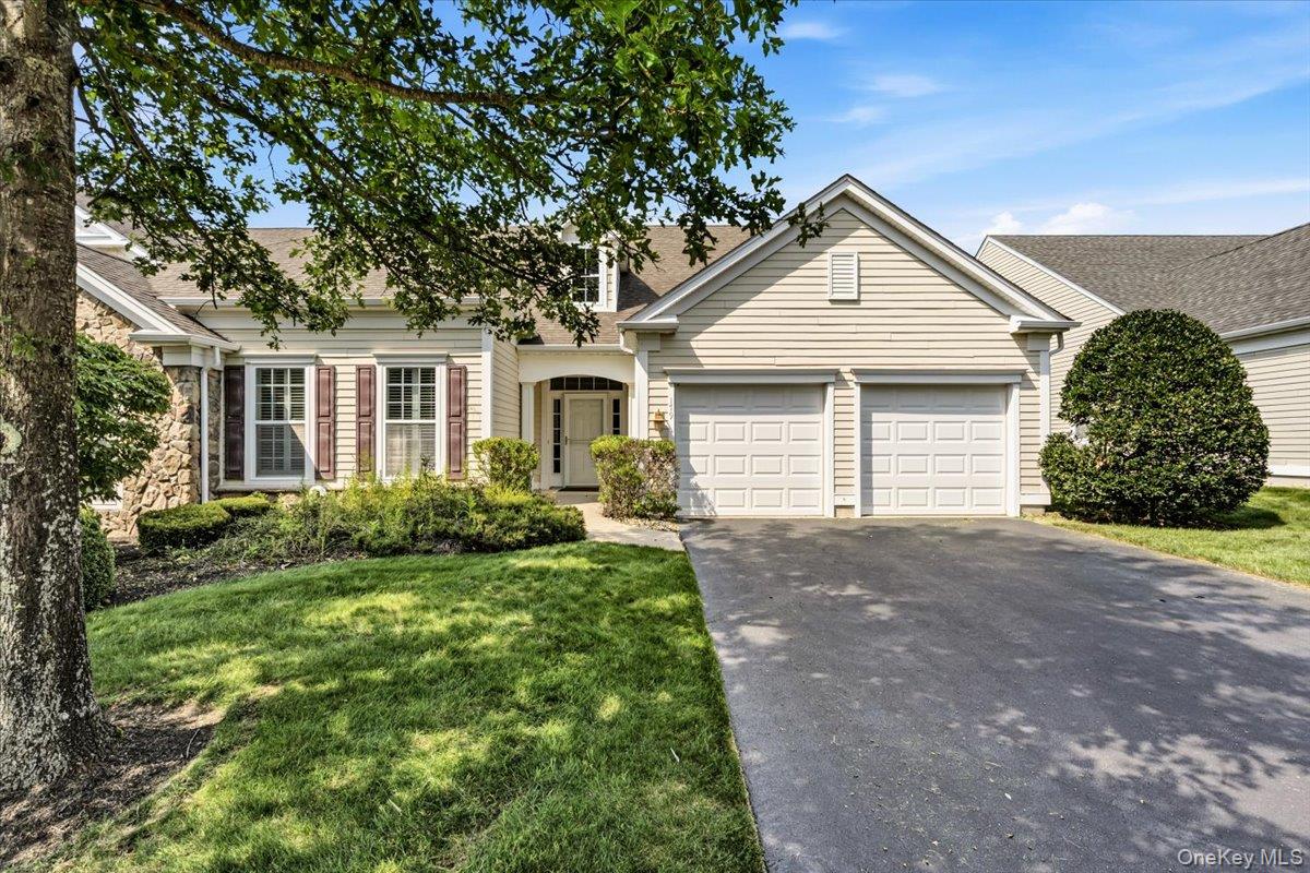 Welcome to Westhampton Pines! This turn key Bridgehampton unit offers 2 generous bedrooms in its one level living. Carly Lane is a quaint residential street that is off the complex's main drive, enjoying a lovely southern exposure. This inviting home has a spacious living room enhanced by a cozy fireplace, eat in kitchen and formal dining room with a small butler's pantry w wine refrigeration.  A primary en suite has a generous walk in closet. The sunny guest bedroom is perfect for those guests and family who come to visit. A handsome and spacious, windowed, eat in kitchen enjoys newer appliances and ample counter space. Two car garage and inviting outdoor patio  (with retractable awning) are added bonuses to this easy living 55+ condo residence.  The Westhampton Pines is home to a beautiful community club house, complete with both indoor and outdoor pools, pickleball and tennis courts, gym and card rooms along with a grand main room. Come discover the beauty of the meticulously manicured grounds with gated entry all within close proximity to the bustling village of Westhampton Beach. Price to sell.