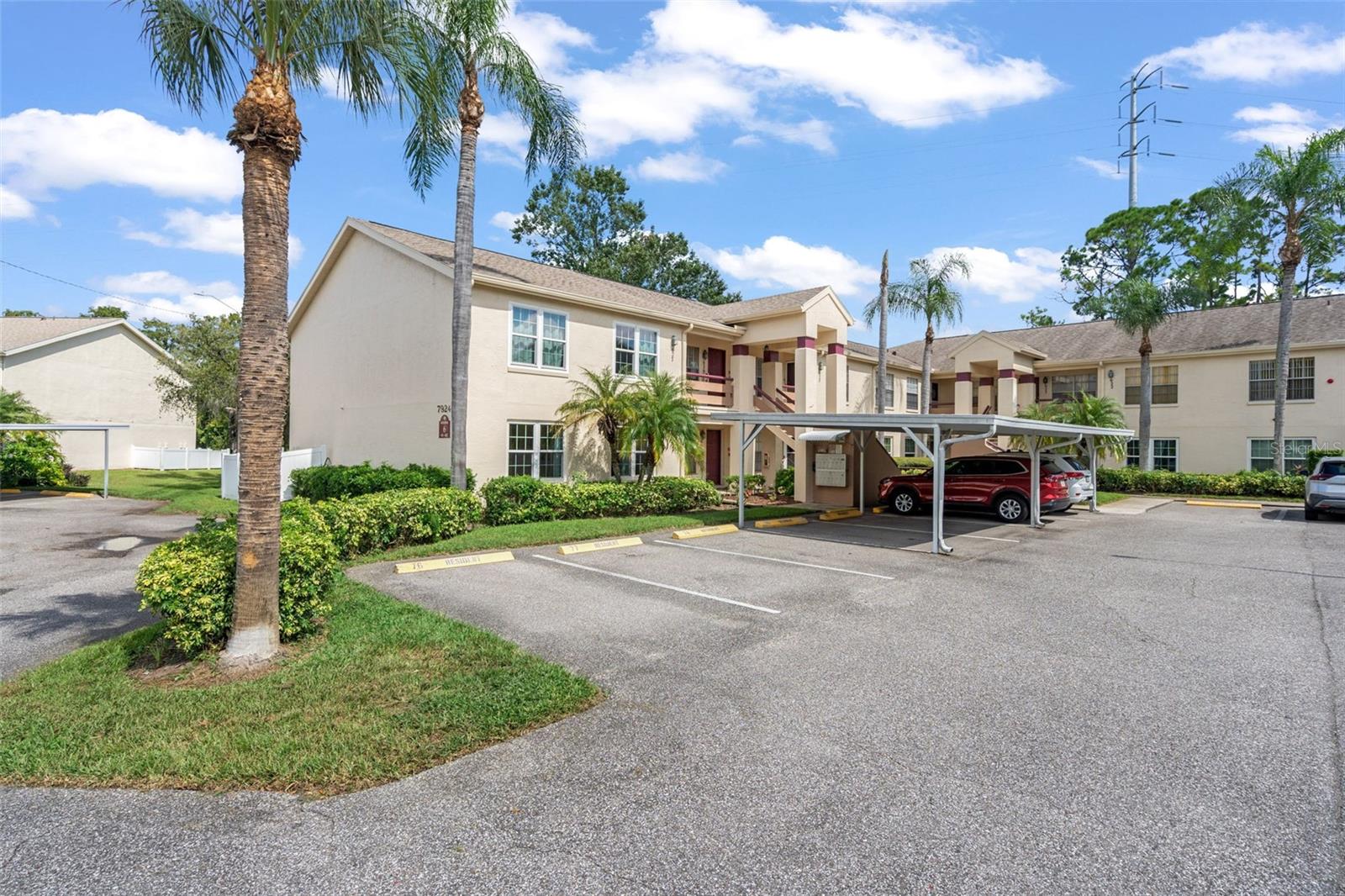 GORGEOUS first floor, END unit condo is completely updated. Luxury vinyl flooring throughout. Beautiful kitchen with new cabinetry, granite counter tops, breakfast bar and stainless steel appliances. Large eating space in kitchen with sliding door access to the screened lanai that overlooks the pond. Great room with ceiling fan, guest bedroom with ceiling fan and large closet, guest bath with tub/shower and new vanity. Primary suite view of the pond, dual closets (one walk in closet), En suite bath with new vanity and walk in shower. Laundry closet with whirlpool stackable washer and dryer. AC 2018, No popcorn, new windows throughout, key pad entry, crown moldting throughout, new six panel doors with black hardware and vinyl louvered closet doors.One assigned parking spot (#78) and one guest spot, just steps from the mailbox. $435 per month fee includes: basic cable, trash, use of amenities (clubhouse, pool, library and work out equipment). Pets permitted with restrictions. Not age restricted. Two pets permitted, with restrictions. See above. Millpond Trace is conveniently located minutes from SR 54. Head East on SR 54 for easy access to Trinity Hospital, Veterans Expressway, I-275 (South to Tampa or North to Weeki Wachee). Or take SR 54 West to US 19 for destinations like Fred Howard Park, Tarpon Springs Sponge Docks, The Aquarium, Honeymoon Island, Caladesi Island, Dunedin, Clearwater Beach or St. Pete Beach.