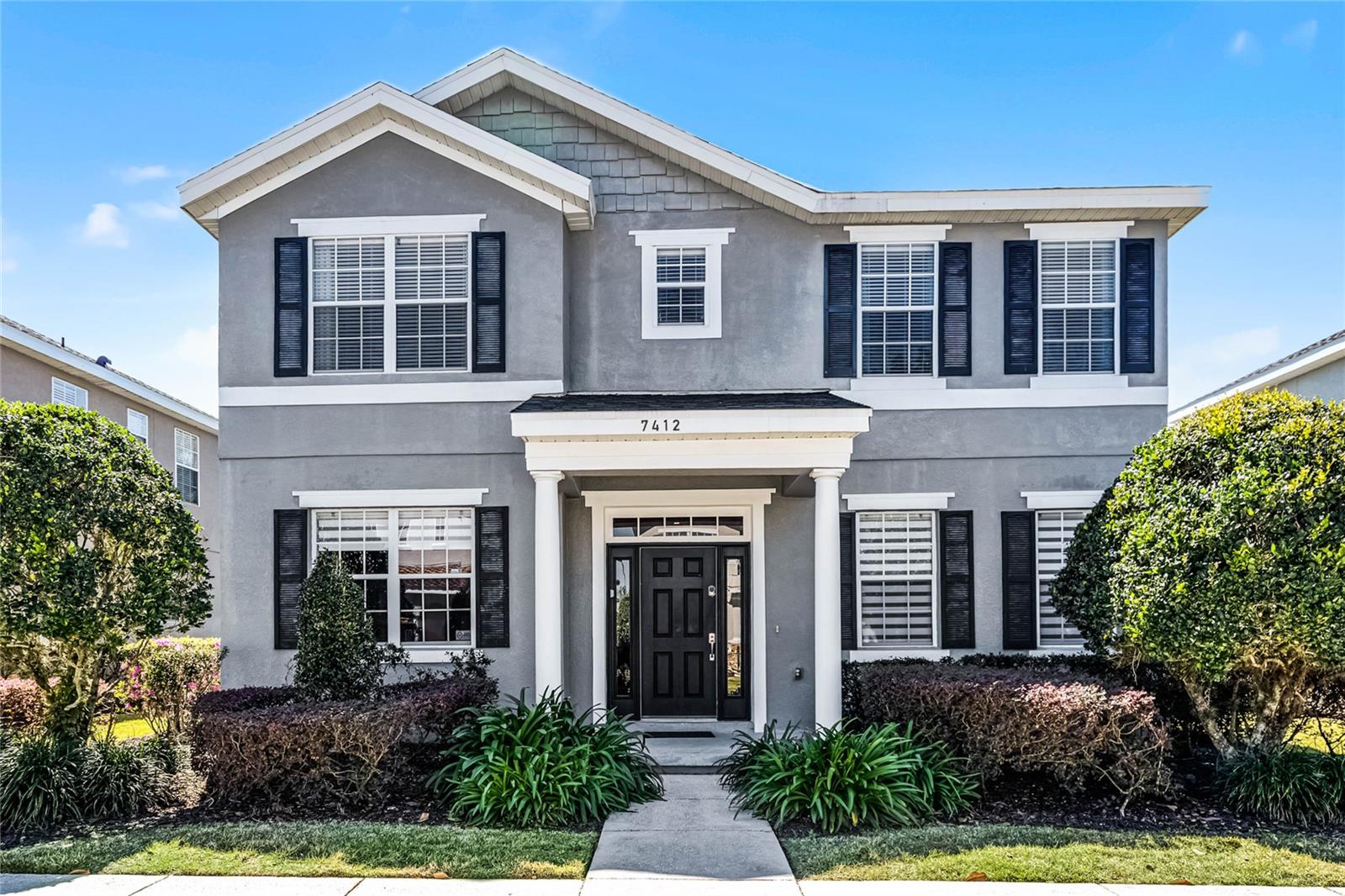 This exceptional, fully furnished, contemporary 5-bedroom, 3.5-bathroom single-family home, located within the desirable, guard-gated Reunion Resort golf community, offers the perfect blend of luxury and leisure. Step into a modernized space boasting pride of ownership, where double French doors lead to a versatile den, ideal as an office or entertainment area. Adjacent, a breathtaking open-concept dining and kitchen area features state-of-the-art 2022 Thermador appliances, including a refrigerator, range, and dishwasher, overlooking the spacious living room. The oversized primary suite, conveniently located on the first floor, includes an ensuite bathroom with double vanity, a large walk-in shower, and a walk-in closet. Four additional bedrooms with two bathrooms are located on the second floor. Enjoy preferred privacy in the courtyard-style lanai, screened-in pool, and spa with included heating. Recent upgrades include a complete pool equipment replacement in 2022, a 2018 AC central unit, a brand new roof and water heater in 2024, and a freshly repaired driveway in 2025. Further enhancements include a complete R1's floor renovation in 2020, and a Pac-Man arcade game. This property grants full membership access to Reunion Resort's renowned amenities, including a water park with a lazy river, three championship golf courses, a tennis complex, multiple community pools, and fitness centers. Enjoy walking distance to the Seven Eagles clubhouse with its resort pool, gym, and dining, as well as the Reunion Grande Hotel for rooftop dining and Disney fireworks views. A dedicated office/6th bedroom, gourmet Thermador kitchen, designer finishes throughout, and resort amenities like a kids club, make this 2,442 sq ft home an exceptional vacation retreat, short-term rental, or permanent residence, located close to Orlando theme parks, restaurants, and shopping.
