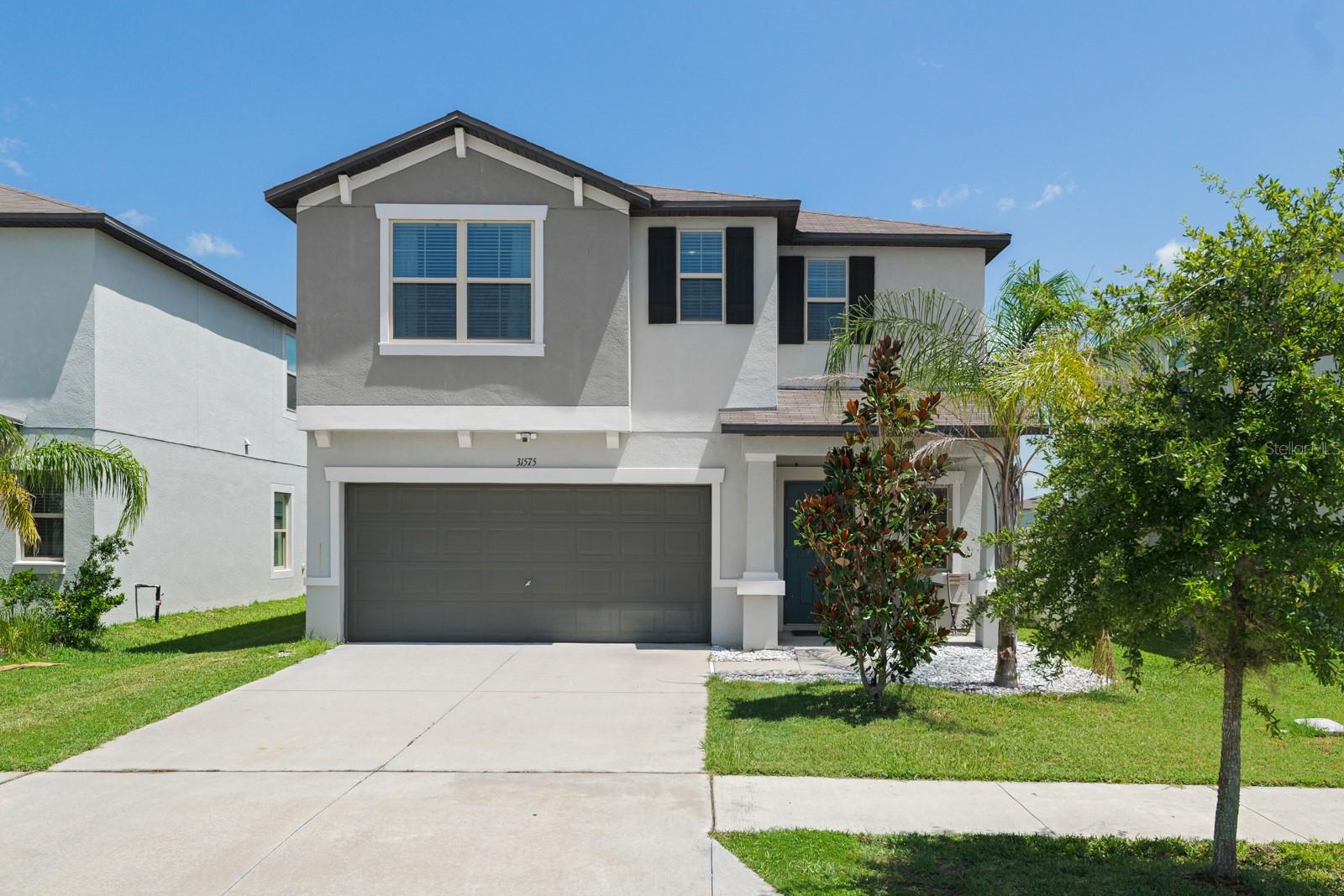 Welcome to the Lagoon Lifestyle! Nestled in the sought-after community of Epperson in Wesley Chapel, this beautifully maintained 6-bedroom, 3-bathroom, 2-car garage home showcases exceptional pride of ownership throughout.Step inside to an inviting open-concept floor plan featuring tile flooring throughout the main living areas, stainless steel appliances, and spacious living and dining spaces ideal for both everyday living and entertaining. The private primary suite offers a relaxing retreat with dual vanities, a walk-in shower, and a generously sized walk-in closet.Outside, enjoy a fully fenced backyard overlooking a tranquil pond an ideal setting to unwind while taking in Florida's beautiful sunset views.As a resident of Epperson, you'll enjoy access to the community's renowned crystal-clear lagoon and resort-style amenities, Golf cart trails, walking trails, Playgrounds, dog parks, offering a lifestyle unlike any other.Epperson is a golf cart community, offering residents unlimited access to the 7.5 acre Crystal blue water Lagoon. Residents can enjoy exclusive Resident events, seasonal celebrations, live music, yoga sessions, paddle boarding, obstacle course, cabanas, and more. Epperson emphasizes a  lifestyle; the community provides opportunities to join volleyball or softball teams, engage in various activities, or simply unwind on the Sandy Lagoon Beaches. Additional amenities within the community are playgrounds, dog parks, Eagles Nests Park, a Lake house clubhouse, and golf cart trails. Nearby schools include Kirkland Ranch Academy, Innovation Prep, Watergrass Elementary, Thomas Weightnman Middle School, and Wesley Chapel High School. The Hoa includes cable and Ultra-Fi WIFI. The home is located minutes away from the KRATES, Tampa Premium Outlets, Shops at The Grove, and easy access to all major roads, I-75, while still offering a quiet neighborhood. This home is a MUST SEE!! Call Today to arrange your Private Showing!