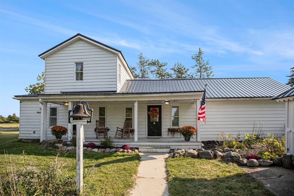 Experience the charm of country living in this beautifully renovated 1810 farmhouse set on 5 serene acres in Howell. The updated kitchen boasts quartz countertops, a walk-in pantry, and a wet bar, while the versatile office/mudroom features custom storage lockers and heated floors. Outside, multiple barns, provide space for a workshop, hobby area, or she-shed, along with plenty of open land for gardening, animals, or simply enjoying peaceful sunsets and visiting wildlife. With a brand new metal roof (2023-2024), this property blends historic character with modern updates, ready for its next chapter.