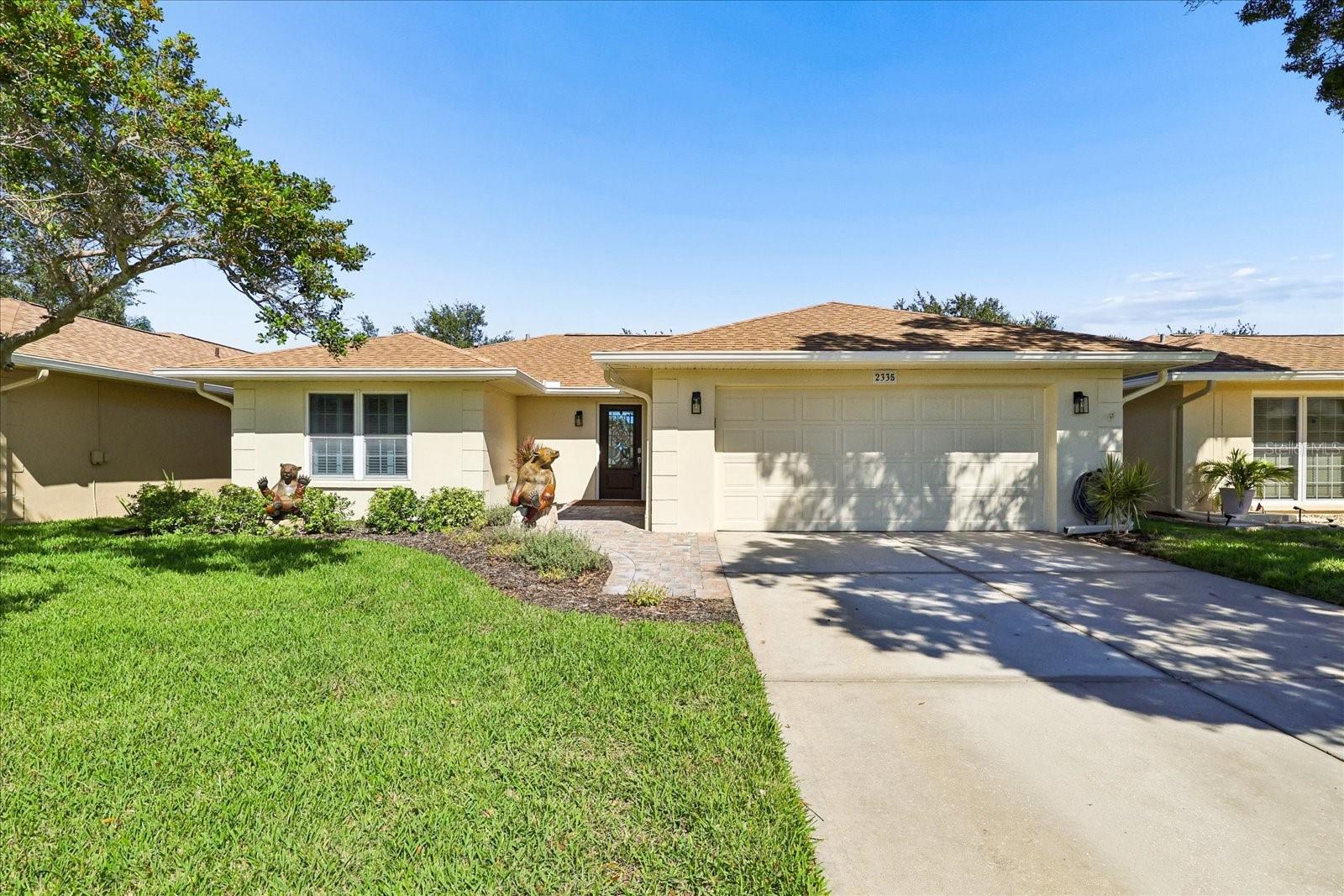 Welcome to this beautifully updated split-floor-plan home, offering a perfect blend of modern style, comfort, and functionality. Thoughtfully enhanced with numerous upgrades. Step inside to discover stylish luxury vinyl plank flooring, complemented by recessed lighting that creates a bright, contemporary feel throughout. The home features updated windows, doors, and sliding glass doors, along with a newer roof (2023) and air conditioning (2024), providing added peace of mind for those big ticket items. Electronic blinds and shades offer a touch of modern sophistication while enhancing comfort and privacy. The desirable split-bedroom layout provides added privacy, with both bedrooms featuring spacious walk-in closets. The large primary suite serves as a relaxing retreat, complete with a beautifully appointed en-suite bathroom featuring a double vanity, a walk-in shower with a seamless glass enclosure, and a lighted mirror for a sleek, modern finish. Additional highlights include a newly installed laundry room with tons of cabinets for additional storage. The newly installed covered rear porch (2025) offers the perfect setting for morning coffee, outdoor relaxation, or enjoying the fresh air year-round. With its thoughtful layout, stylish finishes, and extensive updates, this move-in-ready home offers an exceptional combination of modern conveniences and comfortable living. Conveniently located within minutes to I-275, Publix and Starbucks.