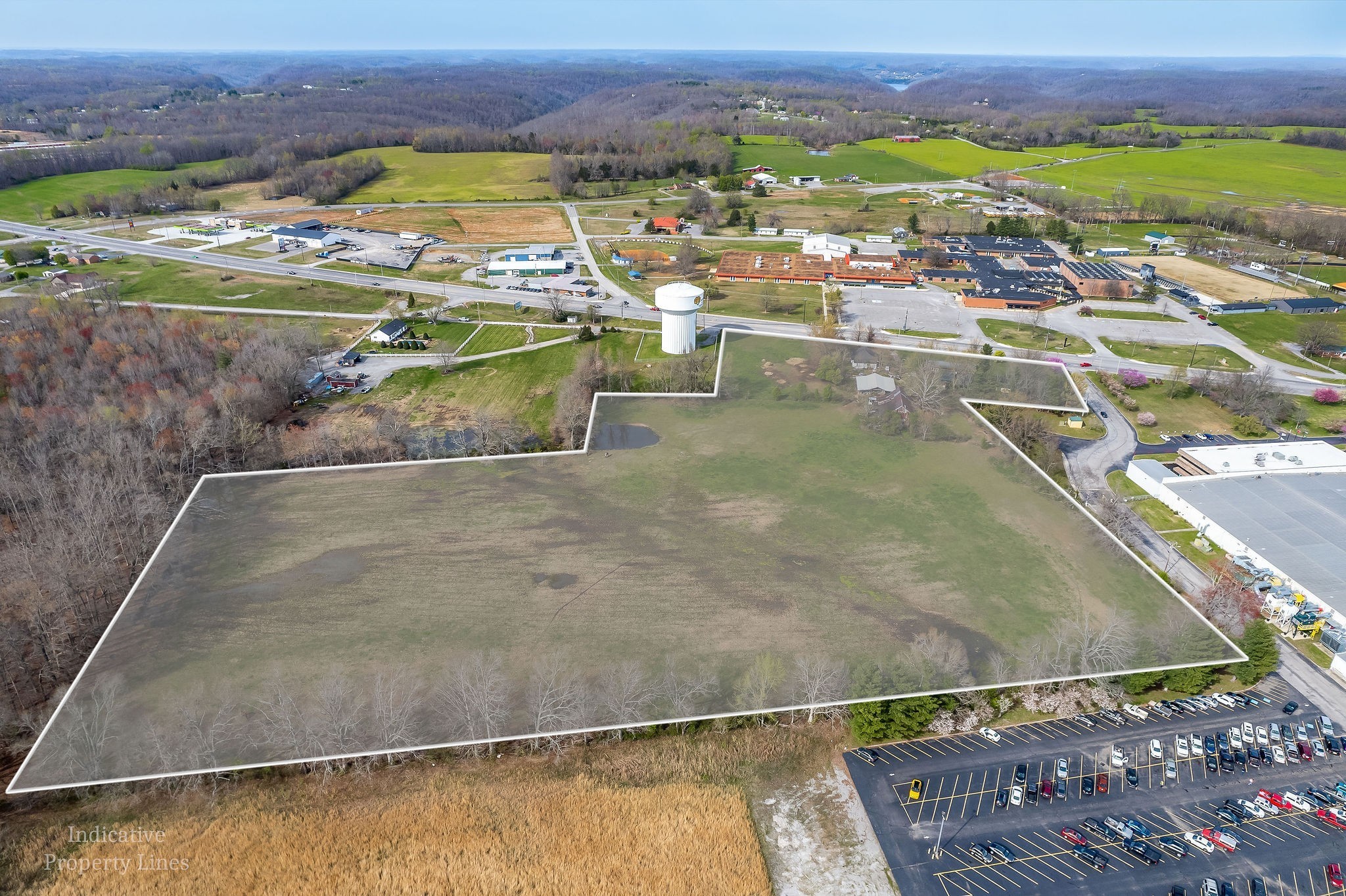 Prime Location with high visibility traffic flow. 2 Parcels selling together. This parcel with brick house and 1 acre is in the city limits. (Seller will get zoned Commercial if needed) Driveway and to the right towards white house and all land in back 12.30+/- acres are in the county has NO ZONING and NO city taxes) All together 13.30+/- acres. This expansive plot of land is situated along a bustling 5-lane highway, the property benefits from its prominent position & offers unlimited potential for possible commercial usage. With no restrictions in place, buyers have the freedom to explore a multitude of possibilities for this land. Whether you envision building several homes, creating a shopping center, establishing a business complex, or starting a new business venture, the possibilities are endless. The high visibility and heavy traffic flow on the nearby highway make this location ideal for attracting customers and clients. The property's size and accessibility offer ample space for constructing extensive developments that can cater to a wide range of needs.  Keep one part as commerical and build a business and the rest to make a subdivision of homes or a mini mall, office buildings, Schools, etc Utilities on property. This listing is about the development of the land than the houses which are selling "As Is". (look under land listing MLS#2898650).