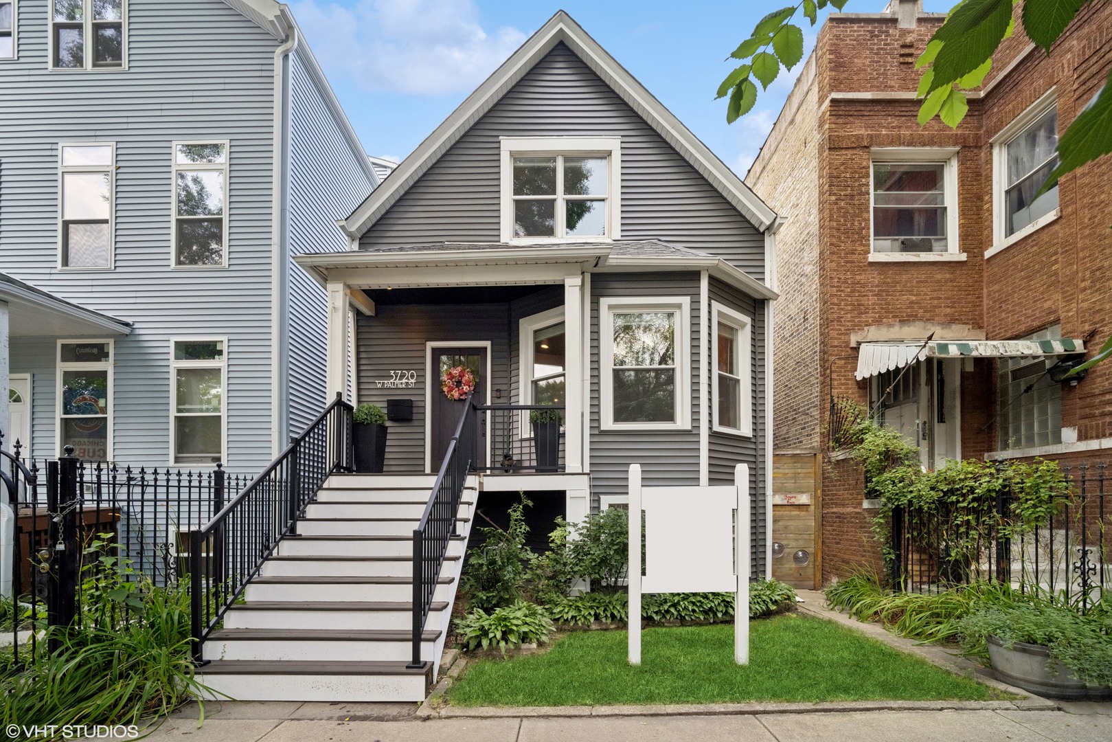 Welcome to this beautifully updated 3-bedroom, 2-bath home in the heart of vibrant Logan Square. With new vinyl siding and windows, this home offers inviting curb appeal and a perfect blend of modern updates and classic charm.  Featuring a newly renovated 2024 kitchen with white shaker cabinets and a spacious island, offering a seamless flow into the dining area.  The main floor includes a comfortable living room, a first-floor bedroom, plus a spacious mudroom between the kitchen and the back deck.   Upstairs, you'll find two more generously sized bedrooms with ample closet space and a full, well-appointed bathroom. The lower level allows for expansion, storage and laundry.  Step outside to a true backyard oasis, complete with a walk-out deck, enough green space to garden, run and play, along with a pergola-covered patio - perfect for relaxing and hosting guests. A two-car garage adds excellent convenience and more storage.  Thoughtfully updated and move-in ready, this Logan Square gem offers style, comfort, and an unbeatable location close to parks, dining, shopping, and public transit.