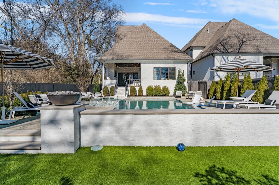 Back on Market-BUYERS FINANCING FELL THROUGH! Dream Home in Green Hills - Zoned for Julia Green! Situated on a quiet street in the heart of Green Hills, this turnkey home offers luxury living at its finest. The custom heated pool by Watermark Pools features a stunning waterfall, spa, and two fire bowls, creating a resort-like retreat in your own backyard. Entertain effortlessly with an outdoor kitchen equipped with top-of-the-line appliances, a fire pit, and custom turf for low-maintenance living. Inside, you'll find high-end custom upgrades throughout, including a spacious primary suite with a large walk-in closet and spa-like bath. Need a second primary suite? This home has it! The home features a large bonus room complete with custom window seats and a built-in wet bar, perfect for entertaining or relaxing. Enjoy expansive walk-in closets and ample storage throughout. Every bedroom boasts its own private ensuite bath, offering ultimate comfort and convenience. Don't miss this rare opportunity to own a fully upgraded, move-in ready home in one of Nashville's most sought-after locations.