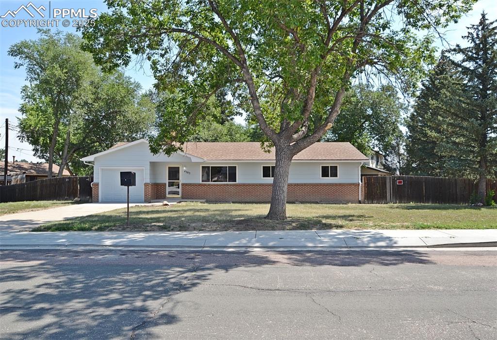 Discover this stunningly updated 4-bedroom, 3-bathroom home, quietly nestled on a spacious corner lot in the sought-after Holland Park neighborhood. Built in 1967, this residence has been fully renovated with modern upgrades throughout, including fresh interior and exterior paint, new flooring, and stylish new lighting. The kitchen is a standout feature, showcasing brand-new cabinets, sleek appliances, updated fixtures, and a modern sink—perfect for cooking and entertaining. Each bathroom has been thoughtfully refreshed, adding to the home's move-in ready appeal. Enjoy the convenience of an attached 1-car garage and a location that offers quick access to I-25 and Garden of the Gods Road. Just minutes from schools, shopping centers, dining, and more, this home perfectly blends comfort, style, and accessibility.