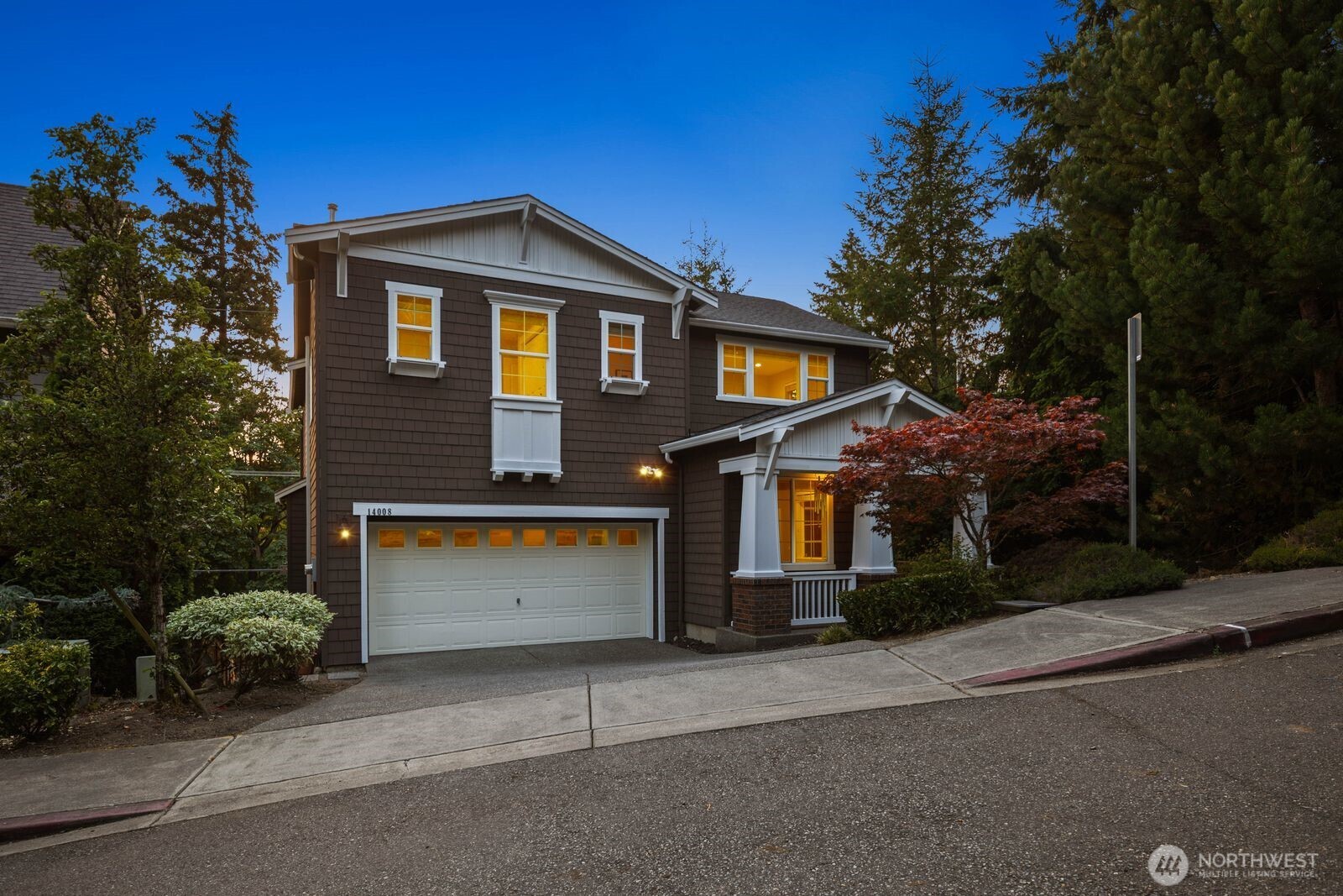 Beautifully updated 5-bed, 3.5-bath home offering three thoughtfully designed levels in East Bellevue. Built in 2013, this home combines modern construction, spacious living areas, timeless finishes, and low-maintenance living in a convenient location just minutes from Downtown Bellevue. The southeast-facing front elevation combined with ample east-to-west exposure fills the home with natural light. The main level welcomes you with soaring 17-foot ceilings, a den, powder room, and an open-concept layout designed for everyday living and entertaining. The spacious kitchen flows seamlessly into the living and dining areas creating a central gathering space with direct access to the deck. Large windows throughout the home maximize natural light and create an open, airy feel across each level. The lower level features a large bonus room with access to the private patio and a separate bedroom / full bathroom, providing flexible space for guests or multigenerational living. Upstairs, the primary suite offers a spacious retreat complete with a five-piece bath and walk-in closet. Three additional bedrooms and another full bathroom complete the upper level. Additional features include central AC and a two-car garage with EV charging. Located within the Bellevue School District and with convenient access to Downtown Bellevue, major employers, parks, shopping, dining, and commuter routes. This home is turn-key with a functional floor plan designed for today's lifestyle.