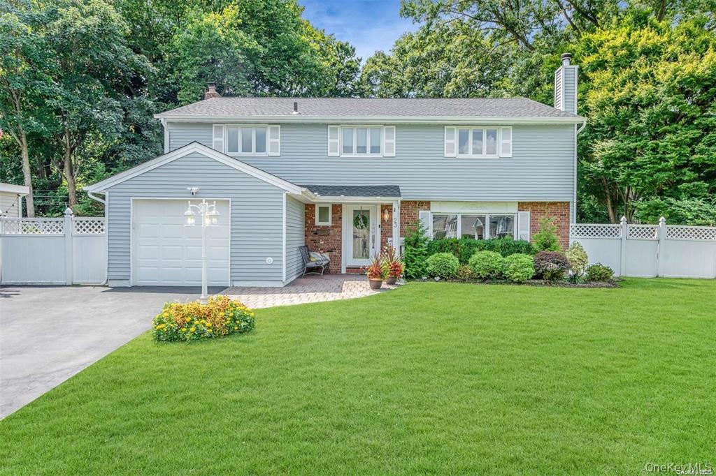 Welcome to 23 Barry Drive, an exceptional Expanded Split-Level nestled in the highly desirable Morgan Park Estates along Long Island’s Gold Coast. Offering approximately 2,291 sq ft, 4 bedrooms and 2.5 baths, this beautifully maintained home combines sophisticated interiors with a truly special setting, including seasonal water views, spectacular sunsets and the peaceful backdrop of Garvies Point Preserve and the Long Island Sound.The heart of the home is the custom Cambridge kitchen, featuring dual granite center islands, Wolf oven and cooktop, pot filler, Italian tile flooring, handcrafted chandeliers and a sun-filled dining area framed by scenic views. The spacious den is perfect for relaxing beside the Napoleon wood-burning stove, while the formal living room offers hardwood floors and an open, airy flow ideal for entertaining.The primary en-suite is a private retreat with vaulted ceilings, recessed lighting, generous closets, a dressing area, full bath and double glass doors leading to an expansive balcony overlooking the preserve. Three additional bedrooms are generously sized and feature hardwood floors beneath the carpeting.A full basement provides excellent additional space for recreation and storage. Recent updates include a newer roof, central air, boiler and oil tank, along with Andersen windows, first-floor laundry, 6-zone in-ground sprinklers and 200-amp electric with subpanel.Just moments from Morgan Memorial Park, the beach and Glen Cove Yacht Club, 23 Barry Drive offers a rare combination of privacy, space, scenic beauty and Gold Coast lifestyle.