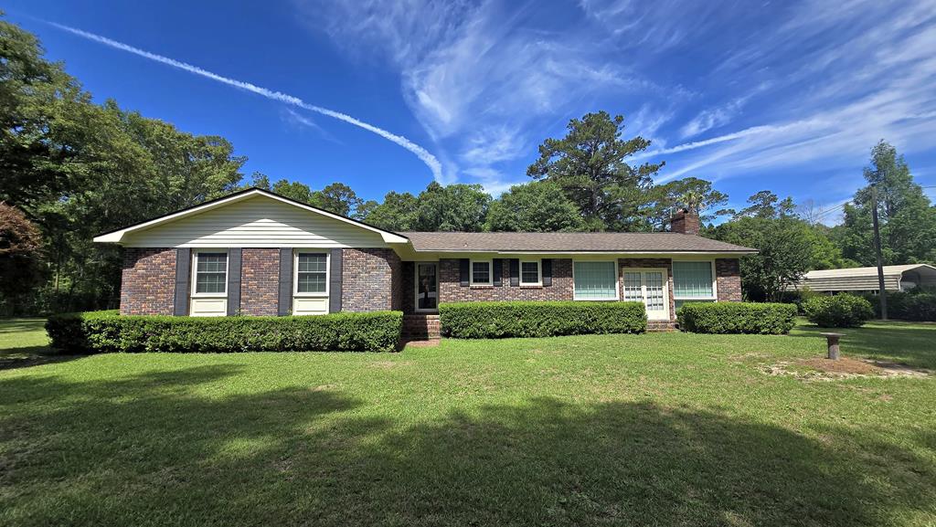 Discover the space, comfort, and versatility you've been looking for at 141 Dechene Drive. This brick home sits on approximately 1.31 acres, offering a rare combination of privacy and room to spread out. The open floorplan creates an easy flow throughout the main living areas, with a welcoming kitchen featuring an island that's perfect for cooking, gathering, or casual meals. A spacious living room anchored by a cozy fireplace provides the ideal spot for relaxing or entertaining. With 3 bedrooms, 2 baths, and an additional bonus room, the layout offers flexibility for a home office, playroom, or hobby space. Outside, the expansive backyard includes a 24 x 30 workshop, a 18x37 RV area that includes electric hook up and water. There are also other workshop buildings on the property, giving you endless possibilities for storage, projects, or creative pursuits. If you're seeking a well-built home with acreage, functional spaces, and room to make it your own, this property delivers a fantastic opportunity in a desirable Thomasville location. Call your favorite Realtor today for a personal showing.