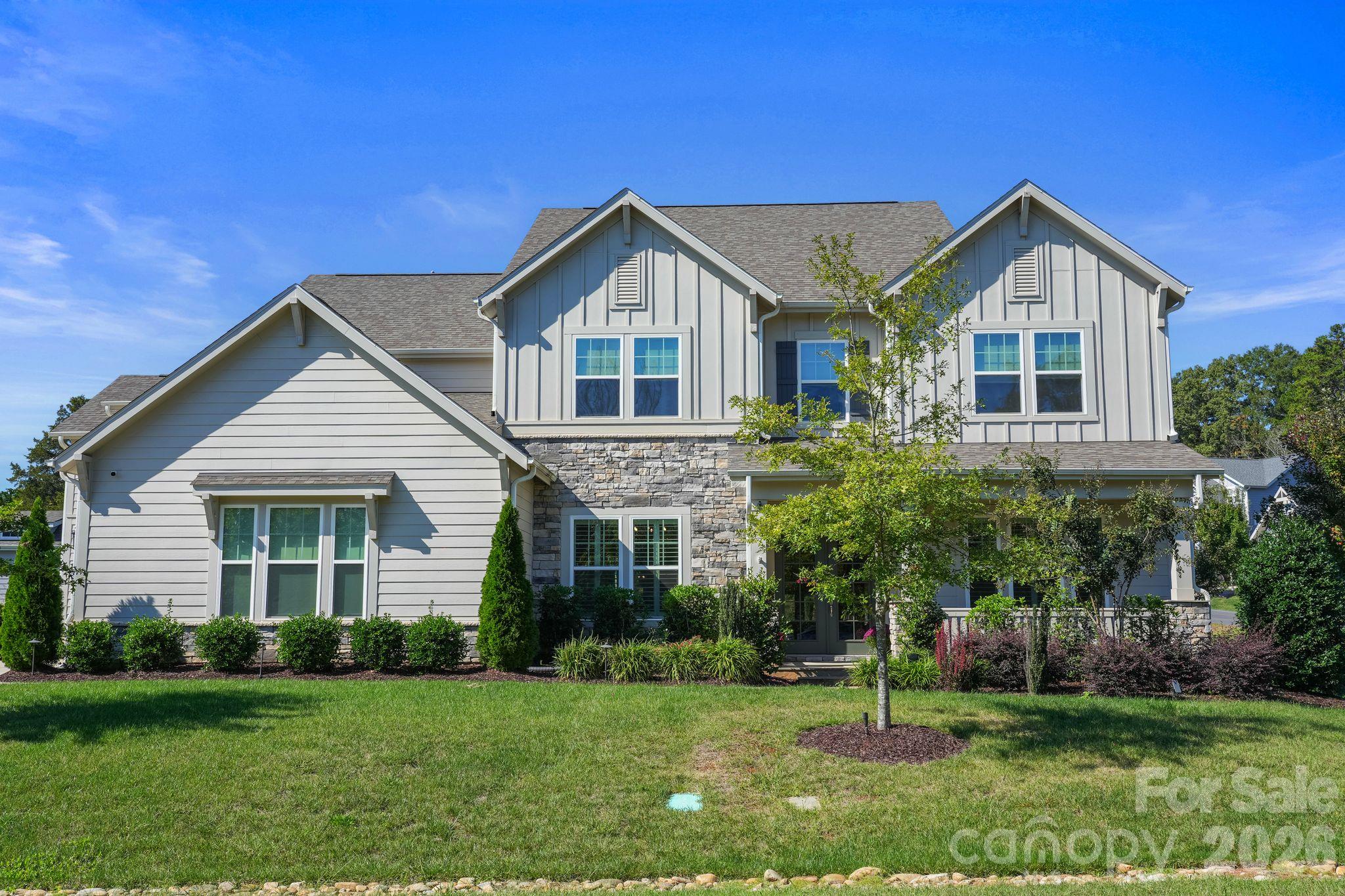 Prime Huntersville Location: Tucked away in the desirable Hollins Grove community along peaceful Cashion's Road, giving you a serene country feel just 10 minutes from Birkdale Village and boating on Lake Norman.Entry & Main Layout: Features an open floor plan accessed via 8-foot French doors, designed for an entertaining lifestyle.Formal Dining & Foyer: Includes a large formal dining room with Plantation Shutters adjacent to the foyer, connected to the kitchen via a butler's pantry, with a nearby powder room for guests.Great Room: Highlights a custom coffered ceiling, gas-log fireplace, and ample windows fitted with Custom Shades .Gourmet Kitchen: Equipped with custom cabinetry, quartz countertops, custom tile backsplash, stainless steel appliances, gas cooktop with canopy hood vent, farmhouse sink, Plantation Shutters in Breakfast Nook along with  dual islands with eat-in bar seating.Office Niche & Pantry: Features a dedicated computer/office niche with built-in cabinets located opposite a large walk-in pantry.Primary Suite & En-Suites: Features a main-level guest en-suite plus a huge upper-level owner's suite with sitting area, dual separate vanities, and separate walk-in closets. 2  Laundry Rooms, One downstairs With built in Cabinets and one Upstairs with built in cabinets as well. Outdoor Oasis: Covered wrap-around rear porch with a floor-to-ceiling outdoor stone gas-log fireplace, adjoining stone paver patio, and a professionally landscaped rear yard.Rare 4-Car Garage: Exceptional parking, storage, or workshop space—a hard-to-find feature in this market.Modern Comforts: Includes a tankless water heater, whole-home water filtration system, and upper-level laundry with built-in cabinetry (includes almost-new LG washer and dryer).Contact the listing agent today to schedule a private tour and learn more about taking advantage of the preferred lender financing!