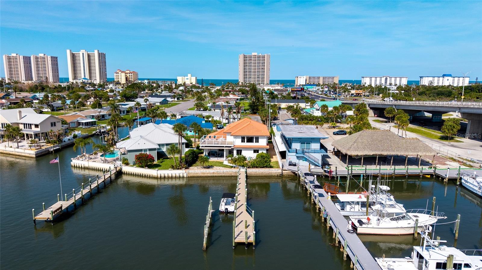 Under contract-accepting backup offers. RARE INTRACOASTAL front Daytona Beach Shores/Ponce Inlet home 3 BLOCKS FROM OCEAN,  DIRECT HALIFAX RIVER & ATLANTIC OCEAN ACCESS,  NEW ROOF, NEVER FLOODED, NO HOA, NO RENTAL RESTRICTIONS, PRIME SECOND HOME & HIGH YIELD INVESTMENT OPPORTUNITY!CUSTOM BUILT solid-construction waterfront gem offering the ultimate Florida boating lifestyle with unmatched second-home appeal and SERIOUS INVESTMENT UPSIDE.Boasting 3,574 sq ft of living space, this 3-bedroom, 4-bathroom single-family home (built 1993) sits on an 1/4th acre lot in the peaceful, quiet cul-de-sac of Halifax Shores. The thoughtfully designed layout features a main-level primary suite for effortless living, two expansive upstairs bedroom suites with private baths, and a standout “River Room” perfect for sunrise coffee or sunset cocktails overlooking the water. Expansive entertaining space outdoors, while recent roof and AC updates ensure worry-free ownership. NO FLOOD HISTORY, direct Intracoastal frontage with a LONG PRIVATE DOCK – this is true deep-water boating paradise with NO bridges RESTRICTING ACCESS to the open Atlantic.Perfect for the boating enthusiast and second-home buyer:Picture effortless weekends or extended stays – launch kayaks, jet skis, or your center-console right from your backyard, cruise the Halifax River, and drop anchor for world-class fishing. Just minutes from Ponce Inlet and the Atlantic, yet tucked away in one of Volusia County’s most desirable waterfront pockets. This isn’t just a house; it’s your personal escape where family memories are made on the water, with easy access to Daytona Beach Shores dining, shopping, attractions, and 15 MINUTES FROM DAYTONA INTERNATIONAL SPEEDWAY. Real estate investors – this is your cash-flow machine with zero restrictions:No HOA. No rental restrictions. Full Airbnb, VRBO, and short-term rental freedom. CAPITALIZE on SKY-HIGH DEMAND during DAYTONA 500, BIKE WEEK, BIKETOBERFEST, JEEP WEEK, and every major holiday. PRIME WATERFRONT LOCATION + OCEAN PROXIMITY = PREMIUM NIGHTLY RATES and YEAR-ROUND bookings from boaters, beach lovers, and event-goers. Strong appreciation in the Port Orange/Daytona Beach market, combined with low maintenance and high occupancy potential, makes this a turnkey investment that pays for itself while you enjoy it as a second home when you choose.WATERFRONT HOMES with DIRECT INTRACOSTAL ACCESS, no HOA, and unrestricted rental potential are extremely rare and move fast in today’s market. Inventory is tight, buyer demand for boating lifestyle properties near the ocean in Florida is surging. Don’t let this one slip away – PROPERTIES LIKE THIS RARELY BECOME AVAILABLE.Schedule your private showing today and secure your slice of Florida waterfront paradise. Live the boating dream, build family traditions, and watch your investment grow. Contact us now for details, virtual tour, or to make an offer on this one-of-a-kind Intracoastal opportunity blocks from the OCEAN before it’s gone!