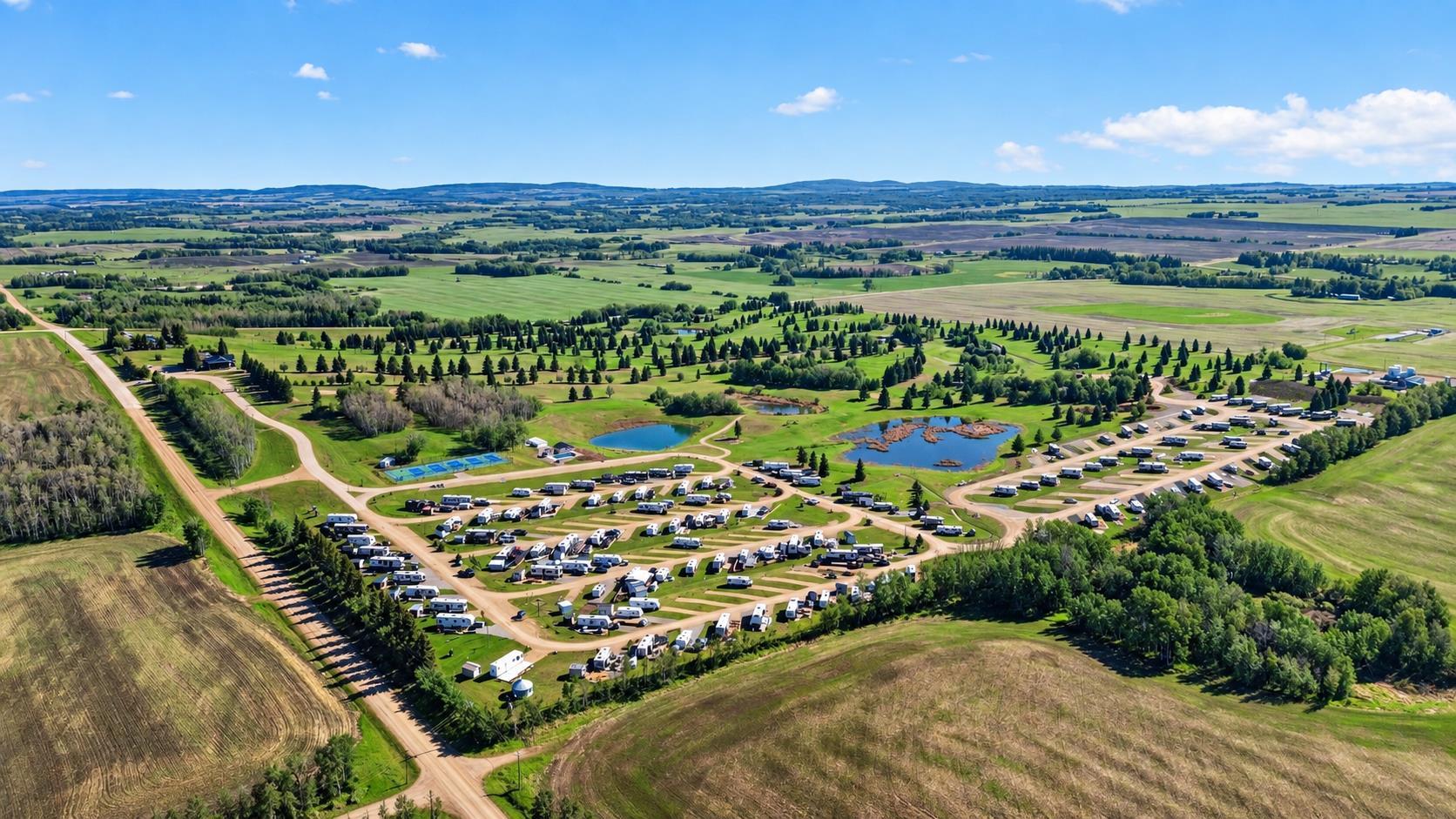 An exceptional opportunity to acquire an established recreational resort and investment property in Central Alberta, offering existing revenue streams, valuable infrastructure, remaining serviced RV lot inventory and significant future development potential.Situated on 153.24 acres near Sylvan Lake, this unique property features approximately 160 developed RV sites, a professionally redesigned 9-hole golf course, clubhouse, restaurant, pro shop, driving range, heated outdoor swimming pool, pickleball courts, swimming ponds, playgrounds and extensive recreational amenities.EXISTING INFRASTRUCTURE & REVENUE OPPORTUNITIES: Approximately 125 RV sites are currently under 35-year ground lease agreements, providing an established ownership and operating structure. The remaining developed RV sites represent an opportunity for a new owner to generate additional revenue through the sale or leasing of existing serviced inventory. RV sites are serviced with water, sewer and power, providing a substantial infrastructure investment already in place.SIGNIFICANT EXPANSION POTENTIAL: Beyond the existing development, the property offers considerable long-term growth opportunities. Phase 3 is currently progressing through the approval process and is designed to accommodate approximately 180 additional RV sites. Future plans also contemplate a potential Phase 4 expansion of approximately 120 additional sites, subject to applicable approvals. Together, these proposed phases offer the potential to substantially increase the resort’s capacity and create additional revenue opportunities.MULTIPLE REVENUE STREAMS: The combination of existing RV ground leases, remaining serviced lot inventory, golf operations, food and beverage facilities, and recreational amenities provides an established foundation for an investor or experienced resort operator. The property’s extensive land base and planned expansion opportunities offer additional flexibility for future business growth.Strategically located in Central Alberta near the popular Sylvan Lake recreational area, this offering combines an established resort operation, significant existing infrastructure and long-term development potential in one comprehensive investment opportunity.Whether you are an experienced RV resort operator, recreational property investor or developer seeking an established property with room for expansion, Alberta Views offers a unique opportunity to acquire a substantial recreational asset with multiple potential revenue streams.NOW OFFERED AT $4,995,000. Detailed financial information, operating statements, development plans and additional property information are available to qualified purchasers upon execution of a confidentiality agreement. Contact the listing agent for further information and to arrange a private viewing.