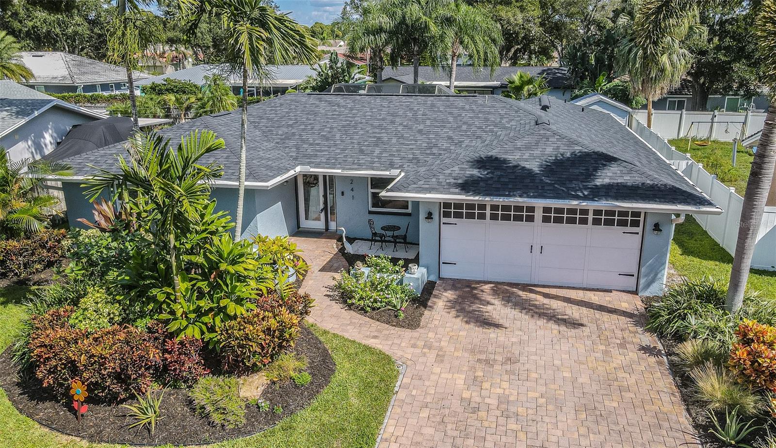**THE BIG-TICKET UPDATES ARE DONE, NOW IT'S TIME TO MAKE THIS HOME YOUR OWN!** Welcome to this spacious 4-bedroom, 3-bath, 2-car garage, pool home in Dunedin's established Ranchwood Estates neighborhood, offering 1,887 square feet of comfortable living space and an impressive list of recent improvements. Major updates include a **NEW ROOF (2026), HURRICANE WINDOWS (2023), HVAC (2022), ELECTRICAL PANEL (2023), and POOL EQUIPMENT (2025)**, allowing you to focus on the improvements you want rather than the expensive ones you need. Inside, the versatile split-bedroom floor plan offers a combination of open and traditional living spaces, including a welcoming living room, spacious family room, and separate dining room currently used as a sitting area. Fresh interior paint, neutral tile flooring, updated kitchen appliances, and abundant natural light create a comfortable, move-in-ready setting. The kitchen offers ample cabinetry, generous counter space, and a convenient connection to the main living areas. Step outside to your own Florida retreat, featuring a sparkling pool surrounded by a spacious screened enclosure with covered space for outdoor dining, relaxing, and entertaining. Additional improvements include fresh exterior paint (2025), new soffits (2026), gutters (2025), added attic insulation (2025), a whole-house surge protector, updated laundry room, and upgraded lanai screening. Situated on an approximately 7,700-square-foot lot with **NO HOA**, this home also enjoys a fantastic Dunedin location. Just approximately 2 to 3 miles from charming Downtown Dunedin, you'll enjoy easy access to waterfront dining, local restaurants, breweries, unique shops, festivals, and entertainment. Beautiful Honeymoon Island State Park is approximately 6 miles away, offering sandy beaches, nature trails, and spectacular Gulf sunsets. Everyday conveniences, including grocery stores, shopping, parks, and recreation, are also nearby. Whether you're enjoying a relaxing afternoon by your own pool, exploring downtown, or spending the day at the beach, this location puts the best of the Dunedin lifestyle within easy reach. **With the major improvements already taken care of, this home is ready for you to move in, settle down, and make it your own!**