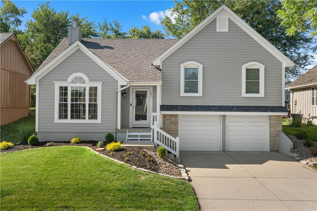 Beautifully Updated Home on the Golf Course and Across from the Lake! This 3-bedroom, 3-bathroom home backs to the golf course and sits directly across from the lake. Main level features a beautifully updated kitchen with Stretta countertops, stainless steel appliances, pantry, and a separate dining area. Vaulted ceilings and a fireplace highlight the spacious family room. The primary suite offers a walk-in closet and en-suite bath with double vanity, separate shower, and soaking tub. A second bedroom and full bathroom complete the main floor. Lower level includes a third bedroom, full bathroom, and storage area in the sub-basement. Home has new deck. 2022 exterior painted and new hvac, 2023 new windows.