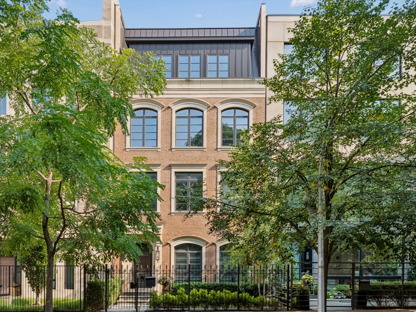 An exceptional East Lincoln Park residence offering sophisticated design, generous proportions, and an extraordinary connection to the outdoors. Ideally positioned on the block to capture beautiful natural light, this meticulously designed home enjoys views of the private park and Chicago skyline from the spectacular rooftop deck. The expansive, thoughtfully conceived floor plan is ideal for both gracious entertaining and everyday living. The main level features an impressive open living space anchored by a chef's kitchen with high-end finishes and appliances, flowing seamlessly into the living and dining areas. Floor-to-ceiling doors open to a park-facing terrace, creating a wonderful indoor-outdoor experience in the heart of the city. Upstairs, the luxurious primary suite offers a private retreat with a beautifully appointed bath and abundant closet space. An additional room can be used as an office, additional closet, or den. Three additional bedrooms are conveniently located on one level, while the flexible floor plan provides the opportunity for a fifth and optional sixth bedroom, ideal for guests, a home office, fitness room, or additional family space: wide floor plan with generous room sizes, first-floor ensuite bedroom/den, open living floor featuring a chef's kitchen and impeccable design, living space seamless to park-facing terrace, entire-floor primary suite with optional 6th bedroom, ideal for guests, a home office, or fitness room. Throughout the residence, timeless transitional finishes, custom millwork, exceptional craftsmanship, and carefully considered architectural details create a home. Generous room sizes and multiple living spaces provide remarkable flexibility. Three bedrooms on one floor, complemented by gorgeous timeless transitional finishes throughout. A secure two-car underground garage provides direct access and additional storage, with a rare opportunity to purchase a third garage space with the residence. You are welcome to use 2550 Lakeview amenities, which include a 1.25-acre private park, indoor pool, fitness center, whirlpool, sauna & steam rooms, sun deck, yoga/pilates room, dog run, valet guest parking, and receiving room. Located in one of East Lincoln Park's most desirable residential settings, this is a beautifully executed city home combining the scale and privacy of a single-family residence with exceptional outdoor space and the convenience of one of Chicago's most sought-after neighborhoods. This beautiful home can be shown with 24 hours notice. Nothing quite like it on the Market.