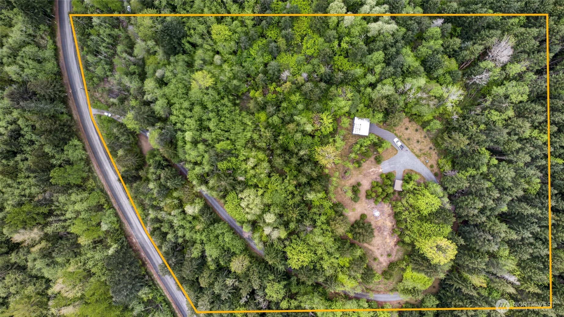 Stunning views await from the top of this shy 4-acre property just outside Eatonville. A cleared, level building site is perfectly positioned to capture breathtaking views of Mt. Rainier—an ideal setting for your custom home or private retreat. Enjoy the peace and tranquility of nature, where deer and elk roam freely, while still being just minutes from Alder Lake for swimming, fishing, and outdoor recreation, and only 30 minutes to Mt. Rainier.This property is thoughtfully improved and ready for your vision. Power has been brought to the site, with RV power hookup already in place. A drilled well is installed, with water lines brought to the top of the site and stubbed out for easy access. The road leading up to the property is lined with gravel and enhanced by a decorative retaining wall, providing both function and curb appeal.Additional features include a gazebo/cabana—perfect for picnics, shade, or even covered parking—and three 20-ft Conex containers offering ample storage or creative temporary space. An expired septic design is on file, giving you a head start in planning.With key infrastructure already in place and endless possibilities, this is a rare opportunity to create something truly special in a beautiful Pacific Northwest setting.