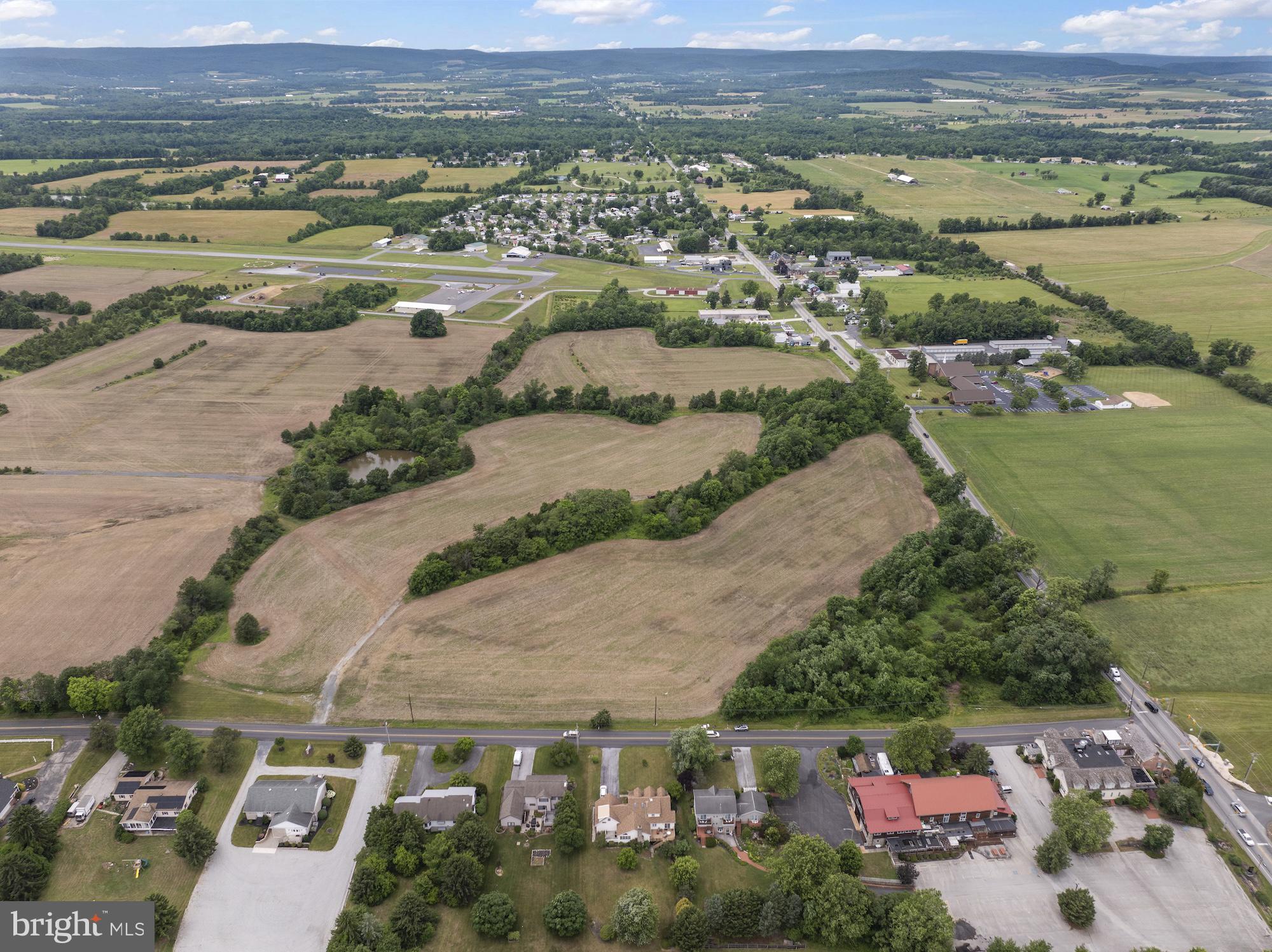 Prime Commercial Mixed-Use Development Opportunity – Gettysburg, PAExceptional opportunity to acquire 27+ acres of commercially zoned mixed-use land at the highly visible intersection of US Route 30 and Herrs Ridge Road, complete with a signalized intersection providing excellent access and exposure. This strategically located property offers tremendous development potential for retail, hospitality, office, residential mixed-use, healthcare, or other commercial ventures.Positioned in one of the region's most recognized tourism and business corridors, the site benefits from strong traffic counts, excellent visibility, and convenient access to major transportation routes. Public utilities are available, enhancing the property's development readiness and long-term value.The location places you less than one mile from the historic First Shot Marker, less than two miles from downtown Gettysburg, less than five miles from US Route 15, and less than twenty-two miles from Interstate 81, providing outstanding connectivity throughout South Central Pennsylvania and beyond.With its combination of size, zoning flexibility, infrastructure availability, and proximity to Gettysburg's thriving tourism, commercial, and residential markets, this is a rare opportunity to secure a premier development tract in a highly desirable location.