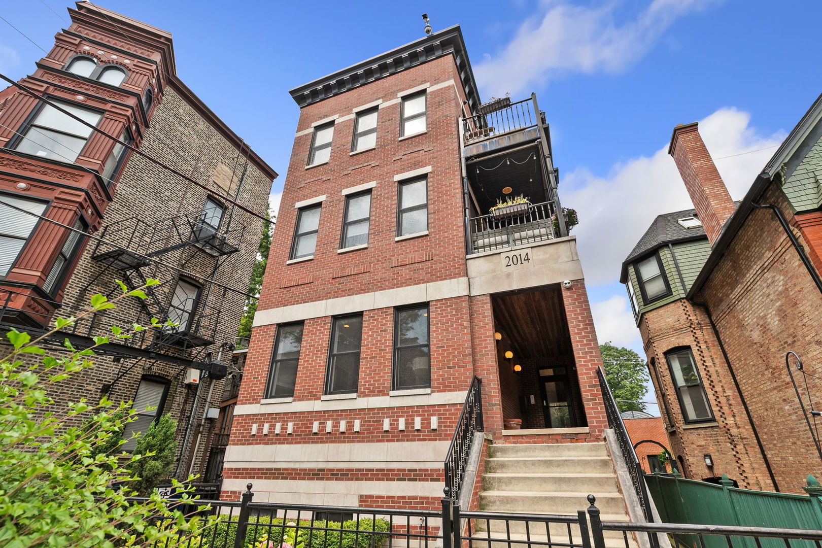 Located in the Oscar Mayer school district, this stunning extra-wide 4-bedroom, 2.5-bath duplex down sits on a beautiful tree-lined street in the prime neighborhood of Lincoln Park. The spacious foyer features a tray ceiling and recessed lighting, leading into the inviting living and dining area adorned with a custom-built gas fireplace, 10-inch crown moldings, recessed lighting, and espresso-finished hardwood floors. The chef's kitchen boasts high-end appliances, including a Wolf 4-burner gas stove with a Zephyr hood, a Sub-Zero refrigerator, Bosch dishwasher, LG built-in microwave, and a wine cooler. Recently painted soft-close cabinets and drawers, complemented by Quartz countertops and a backsplash, provide ample storage, while the island offers additional space and a bar stool overhang for casual seating. The primary bedroom features his and hers California walk-in closets, a large private patio, and an en-suite bath with a dual marble vanity, steam shower, whirlpool tub, and a separate toilet. The generously sized second, third, and fourth bedrooms also feature California closets. The lower level boasts radiant flooring throughout, a laundry room, and a large storage closet under the stairs. Outdoor living is enhanced by three spaces, including a deck, patio, and the primary bedroom's private patio, all wired for sound, perfect for entertaining. Additional recent updates include carpeting in the lower level (2018), a sump pump with battery backup (2018), washer and dryer (2021), kitchen counters and backsplash (2022), AC coil and condenser (2023), dishwasher (2023), and water heater (2024). This exceptional home offers comfort, style, and convenience in a highly sought-after neighborhood.