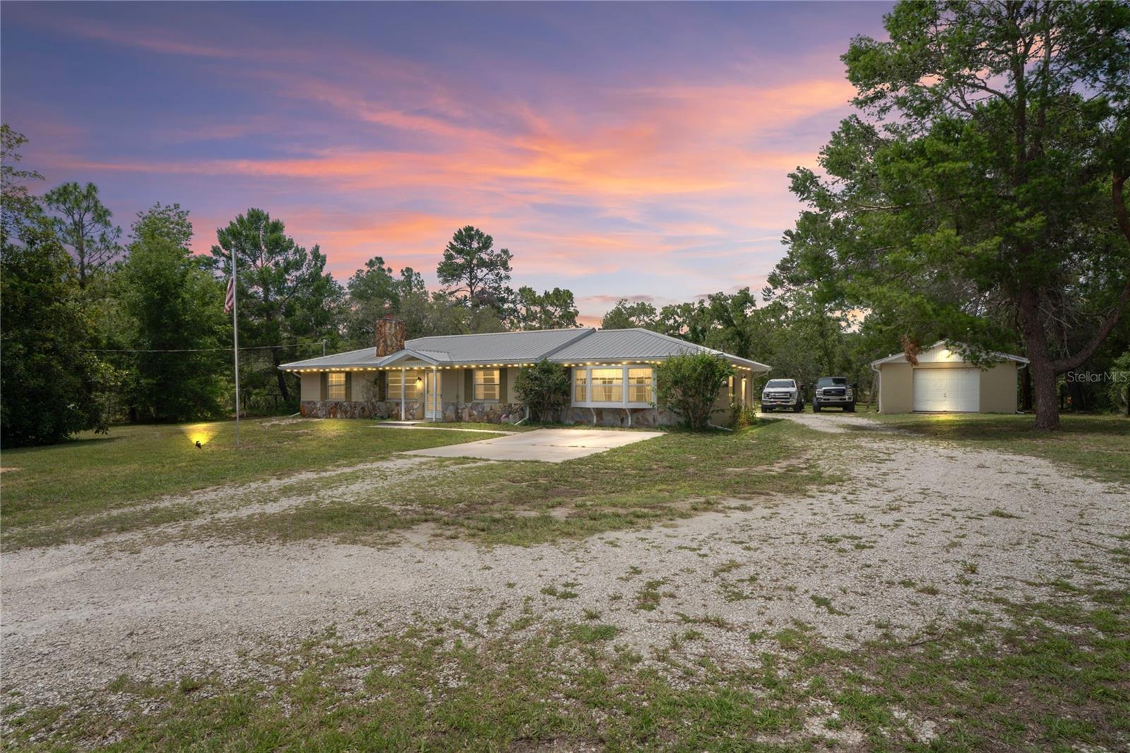 Welcome to your charming country escape! This spacious 3-bedroom, 2-bath ranch-style home offers classic farmhouse charm on 1.30 acres of agriculturally zoned land (AR2) — perfect for those looking to bring farm animals or enjoy more open space. With over 2,020 sq ft of living area, there’s room for the whole family, including an oversized family room that could serve as a 4th bedroom, home office, or den. Step inside to find a cozy stone wood-burning fireplace, laminate and vinyl flooring throughout (no carpet!), and a gas tankless water heater and gas stove for energy efficiency. Enjoy the convenience of indoor laundry with a utility sink and plenty of storage. Outdoors, relax by the in-ground swimming pool, which features a brand-new screens for the enclosure and pool filter. The property also includes a detached 1-car garage and workshop (468 sq ft) equipped with electric and water—ideal for hobbies, storage, or farm equipment. Recent updates include: 2015 Metal Roof, 2010 AC (well- maintained) and new fence post. Located outside of a flood zone, this home offers not only space and charm but unique opportunities—it's less than 10 minutes from the Flamingo One Loft Race, making it a rare gem for those interested in raising or racing pigeons! Close to shopping, hospitals, restaurants and the famous Weeki Wachee Springs State Park home to our mermaids.