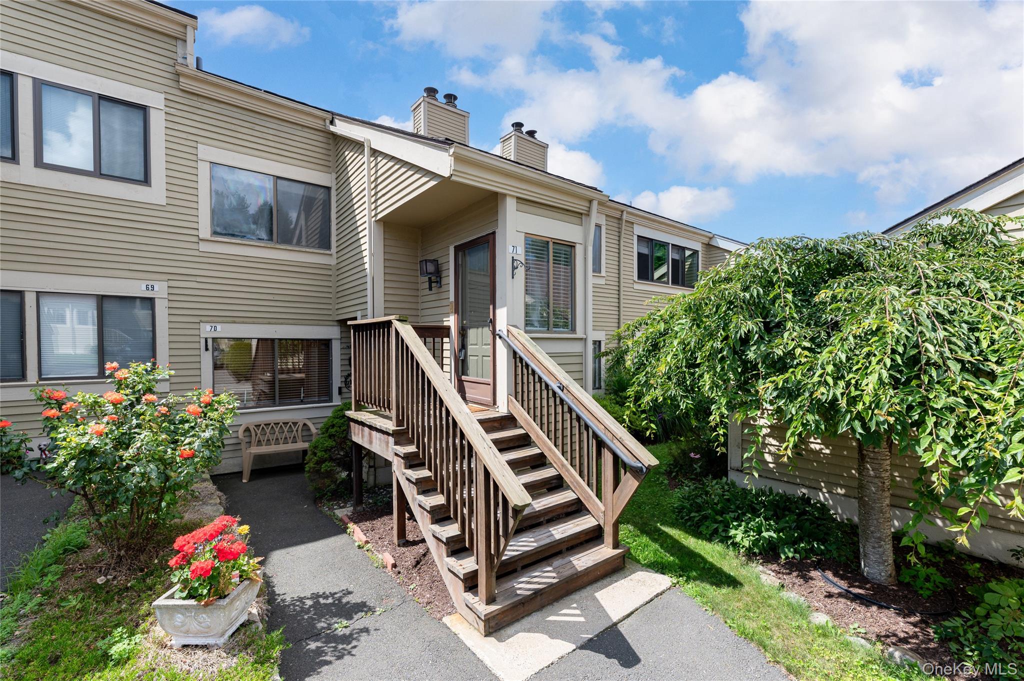 This lovely 2-bedroom, 2-bath home in the Oakridge Development offers both comfort and versatility. The entryway leads up to a bright and inviting living room with a fireplace that flows seamlessly into the dining area and kitchen, creating a warm and open concept living space. The kitchen features a sliding glass door that opens to a deck perfect for relaxing or entertaining, where you can enjoy seasonal lake views.

The primary bedroom includes its own full bath and two spacious closets, while the second bedroom also offers generous closet space. A half hall bath completes the main level.

Upstairs, the loft space overlooks the main level and includes a separate bonus room ideal for a home office, guest room, and/or hobby space. Whether you're working from home or hosting overnight guests, this flexible layout fits a variety of needs.

Community amenities include a pool, kiddie pool, tennis courts, basketball courts, and a children’s play area. Commute with ease from New Canaan or Katonah via Metro-North. Plus, you're within walking distance to a convenient shopping plaza.