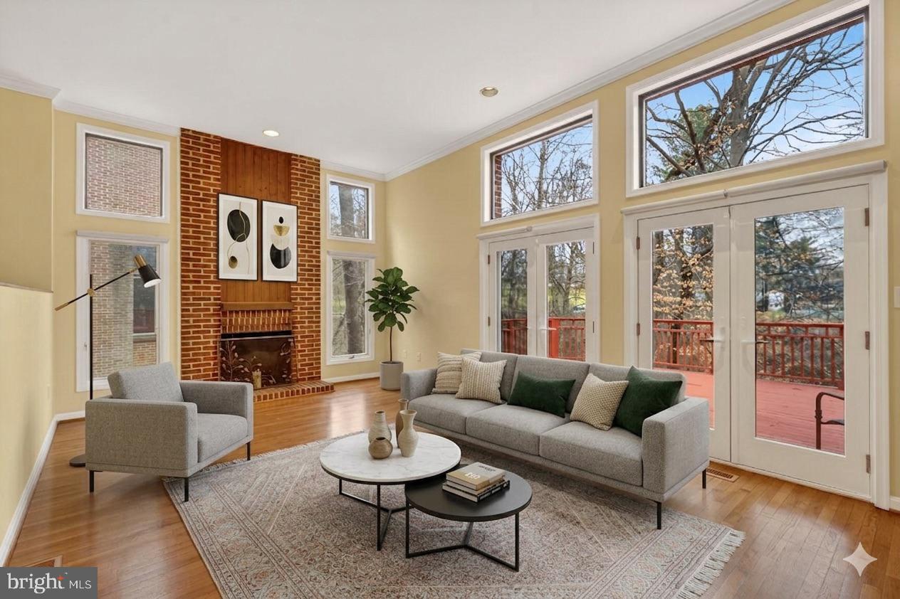 Immaculate and move-in ready, this striking contemporary townhome features soaring 12-foot ceilings, abundant natural light from skylights, and a beautifully open layout ideal for both everyday living and entertaining.Located within a top-rated school district, the home also offers the convenience of a Ride-On shuttle just outside the door to the Bethesda Metro, making commuting effortless. Enjoy luxury, low-maintenance living surrounded by the serene, wooded setting of the highly desirable Bethesda Crescent community.Distinctive architectural details include exposed brick accents and hardwood flooring throughout. Outdoor living is equally inviting, providing the perfect space for relaxing or entertaining. For added convenience, the home includes a fully finished walk-out lower level with a second kitchen and an additional washer, offering excellent flexibility for extended living.The lower level functions beautifully as an in-law or guest suite, featuring a bedroom, living area with fireplace, renovated full bath, and a  patio overlooking the peaceful, tree-lined views of the Bethesda Country Club.  This is a rare opportunity to own a thoughtfully designed, one-of-a-kind home in one of Bethesda’s most sought-after neighborhoods.